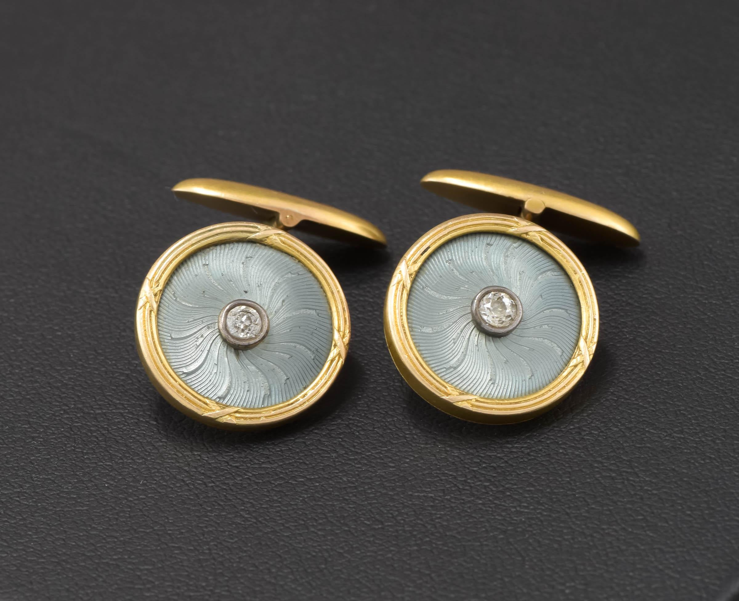 Offered is an elegant pair of Imperial Russian antique guilloche enamel cufflinks with fiery old European cut diamonds.  Fully hallmarked, they remain in wonderful condition.

The enamel has a particularly lovely color - a shimmery slate
