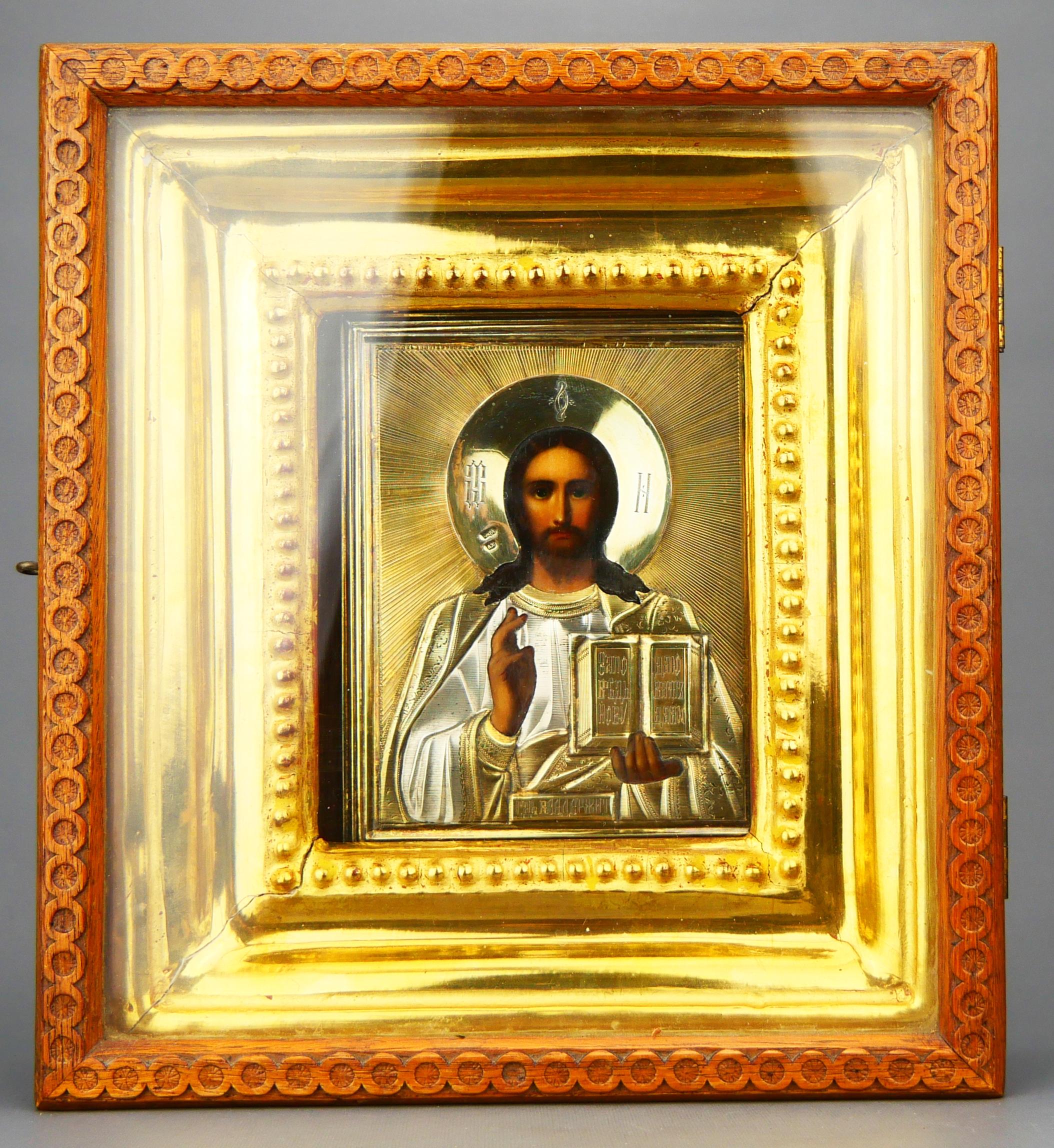 Antique Russian Orthodox icon of Christ Pantokrator  hand - painted with tempera on canvas stretched on wooden panel with velvet textile backing. Icon is covered with original Gilt 84 Silver hand - engraved  and chased Silver oklad and placed in