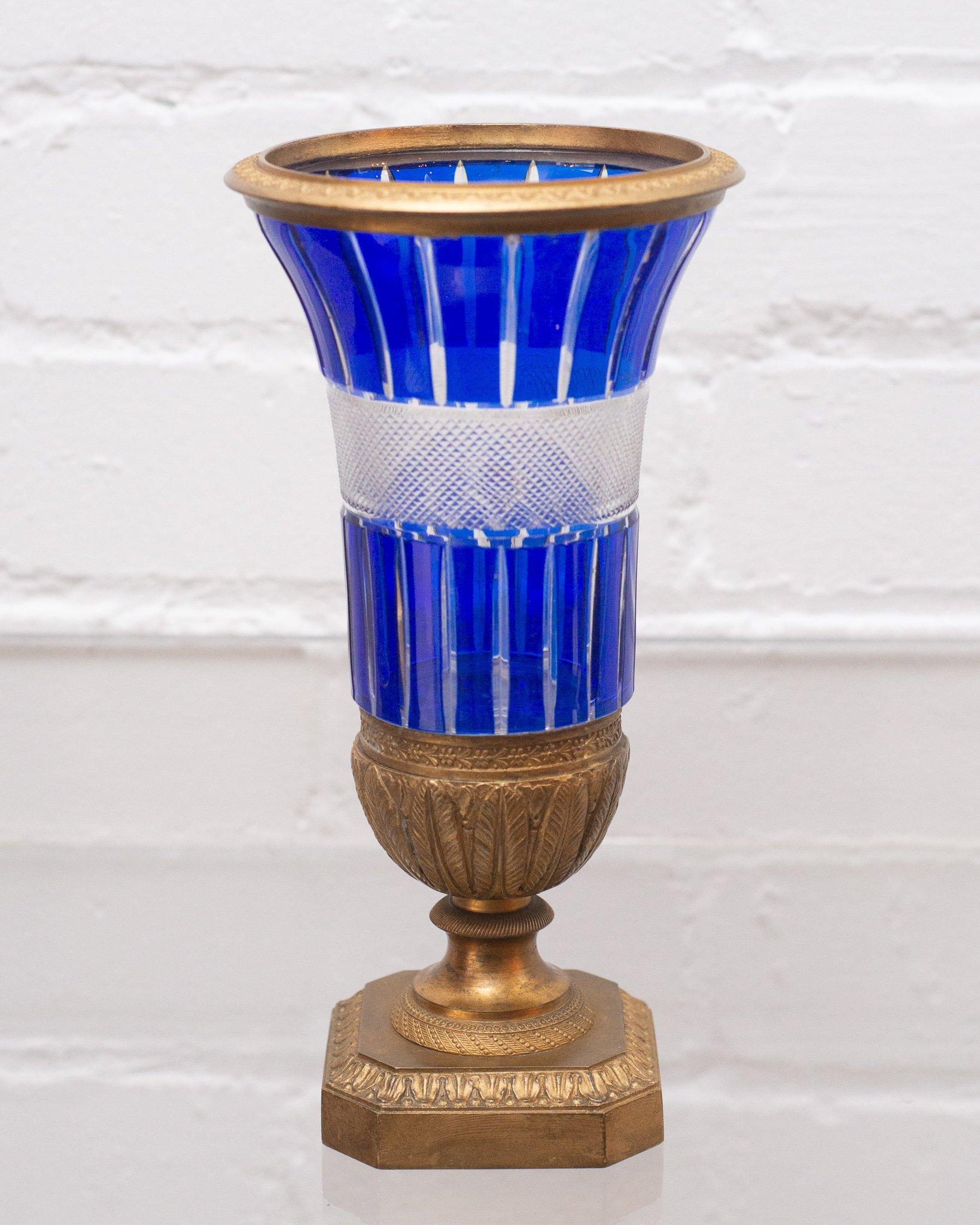 An ornate Russian Imperial cobalt blue and clear cut crystal vase, circa 1890, with bronze mount. This elaborate hand cut crystal catches the light beautifully.