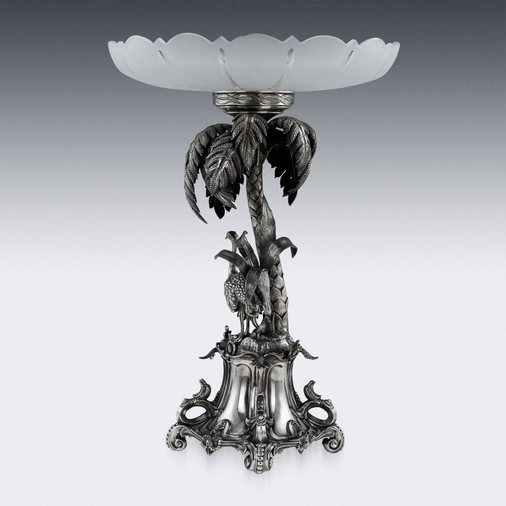 Antique 19th century Russian import solid silver centrepiece in a form of a palm tree, the base of the tree decorated with various exotic foliage and applied with a figure of an ostrich, the four sided base embossed with flowers, scroll work and