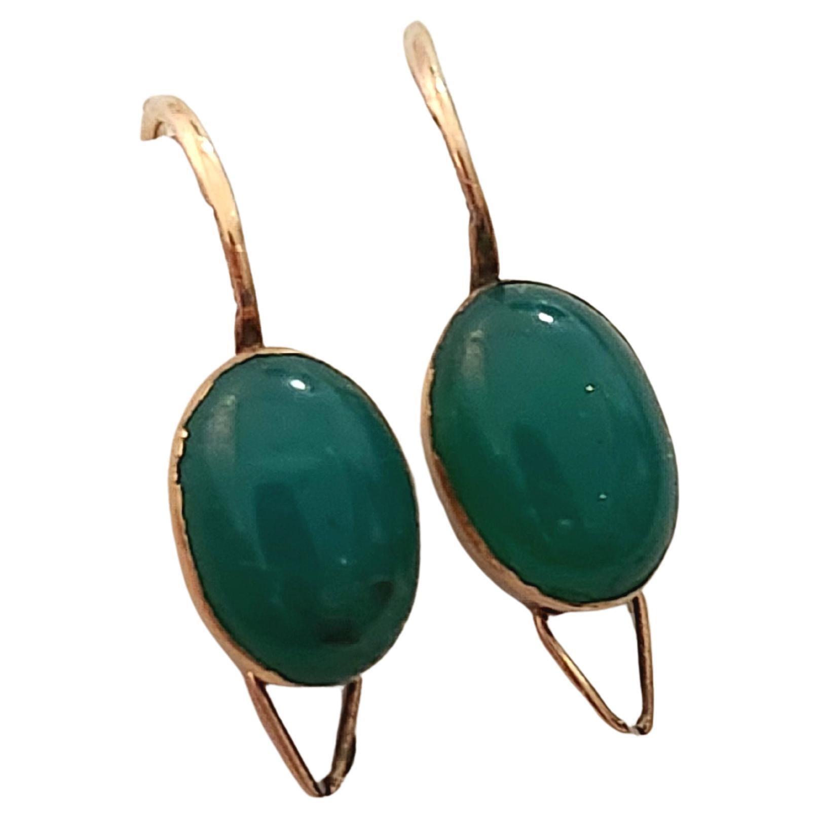 Antique imperial russian era 1900s 14k gold earrings centered with natural oval green jade stone with safty lock earrings back hock hall marked 56 imperial russian gold standard and initial maker mark in cyrtlic aphabet earrings lenght 2cm