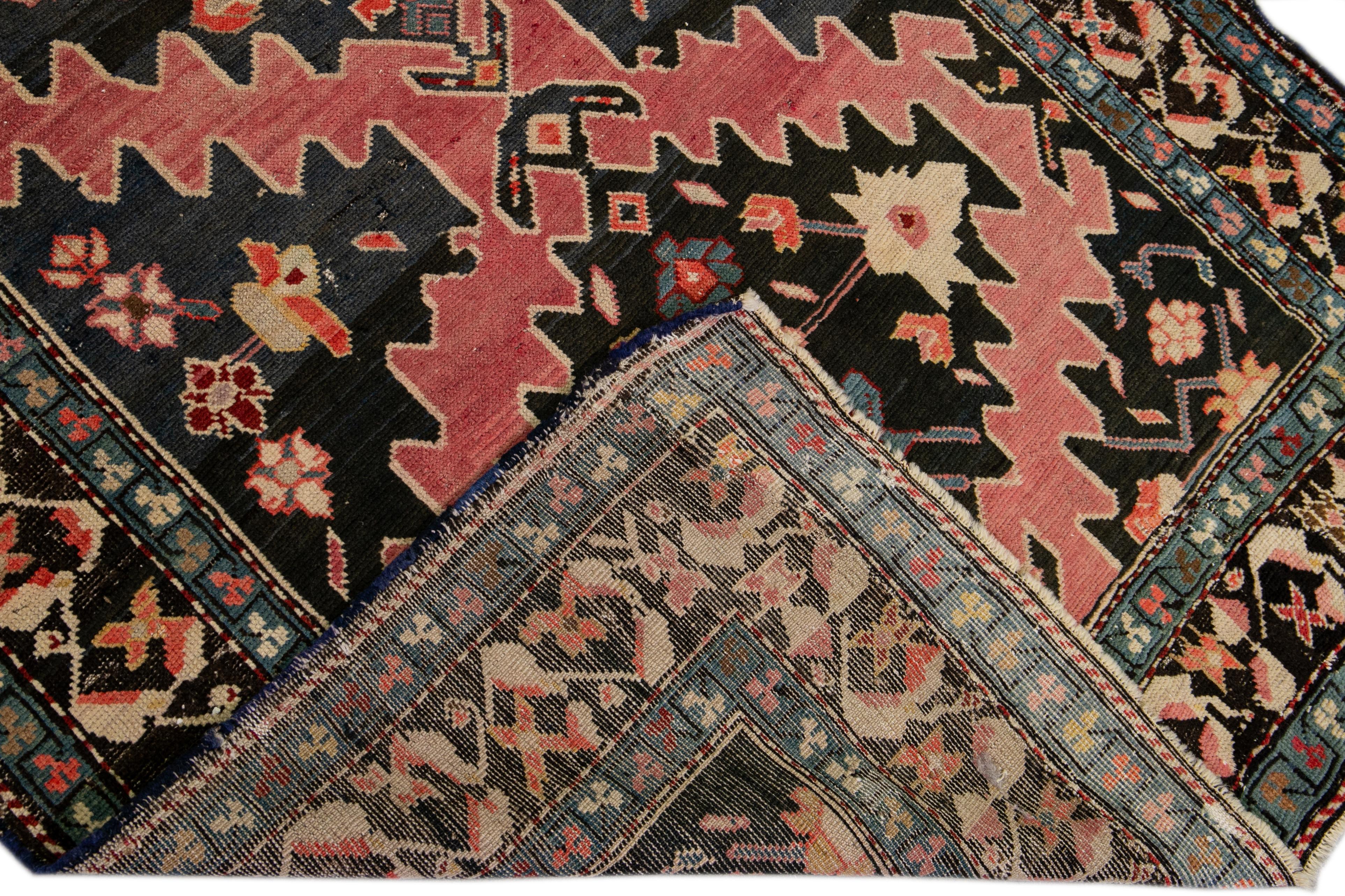 Beautiful Russian Karabagh hand-knotted wool rug with a blue field. This piece has multicolor accents throughout the tribal design. 

This rug measures: 3'9