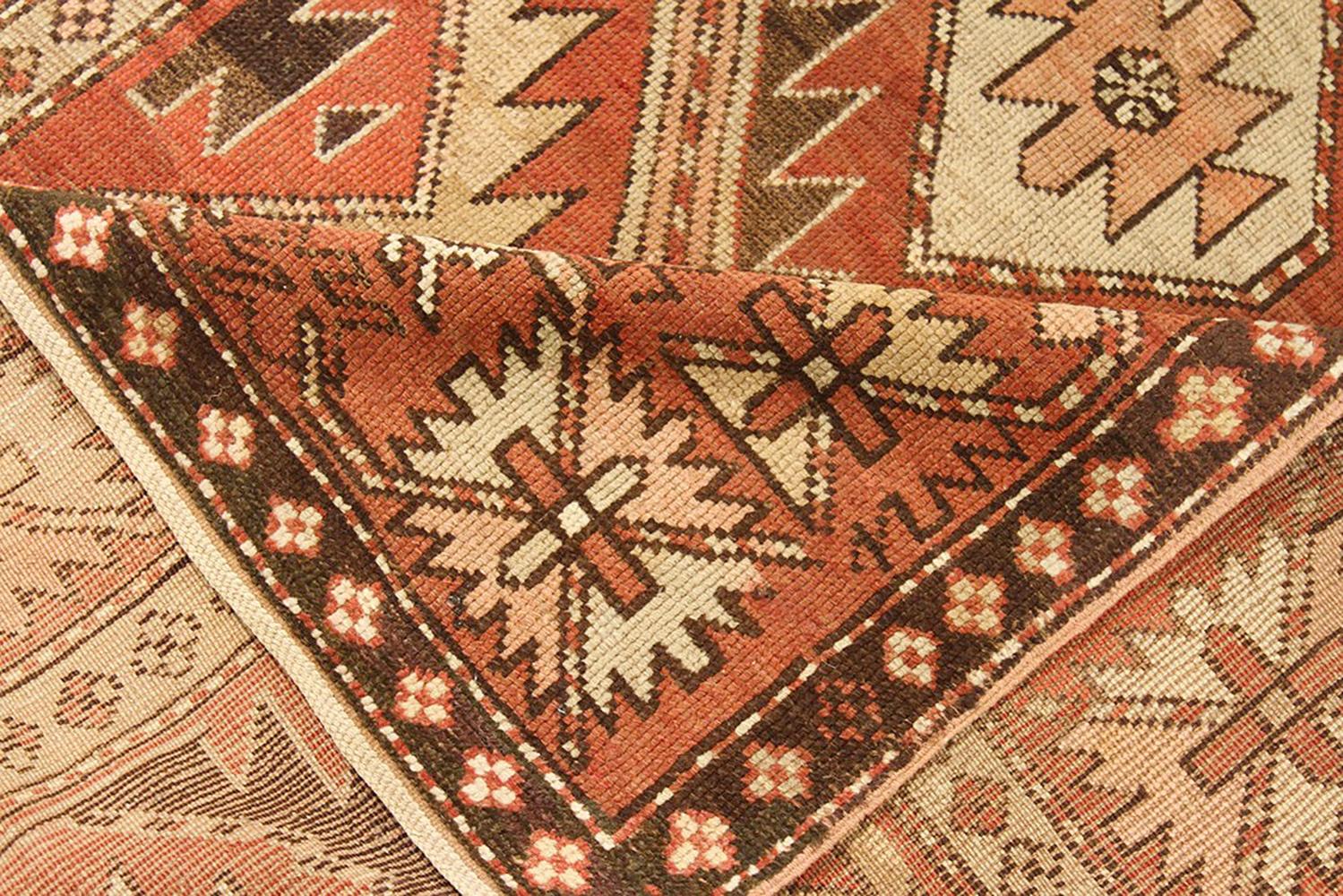 Hand-Woven Antique Russian Kazak Rug with Beige and Brown Geometric Medallions For Sale