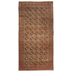 Ancien tapis russe Khotan avec médaillons octogonaux beiges et marines sur fond orange