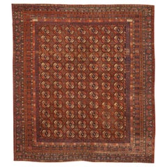 Antique Russian Khotan Rug with Black & Ivory Octagon Medallions on Red Field