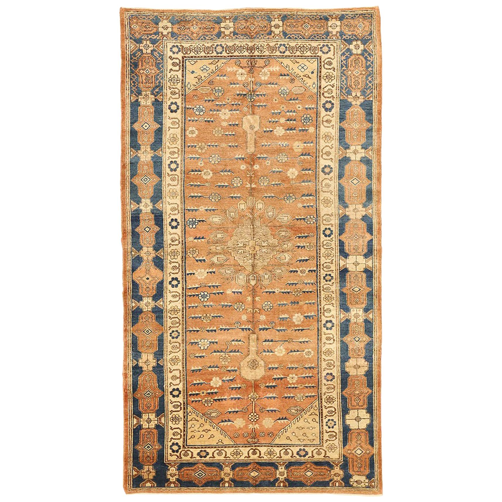 Antique Russian Khotan Rug with Blue and Beige Floral Patterns on Brown Field