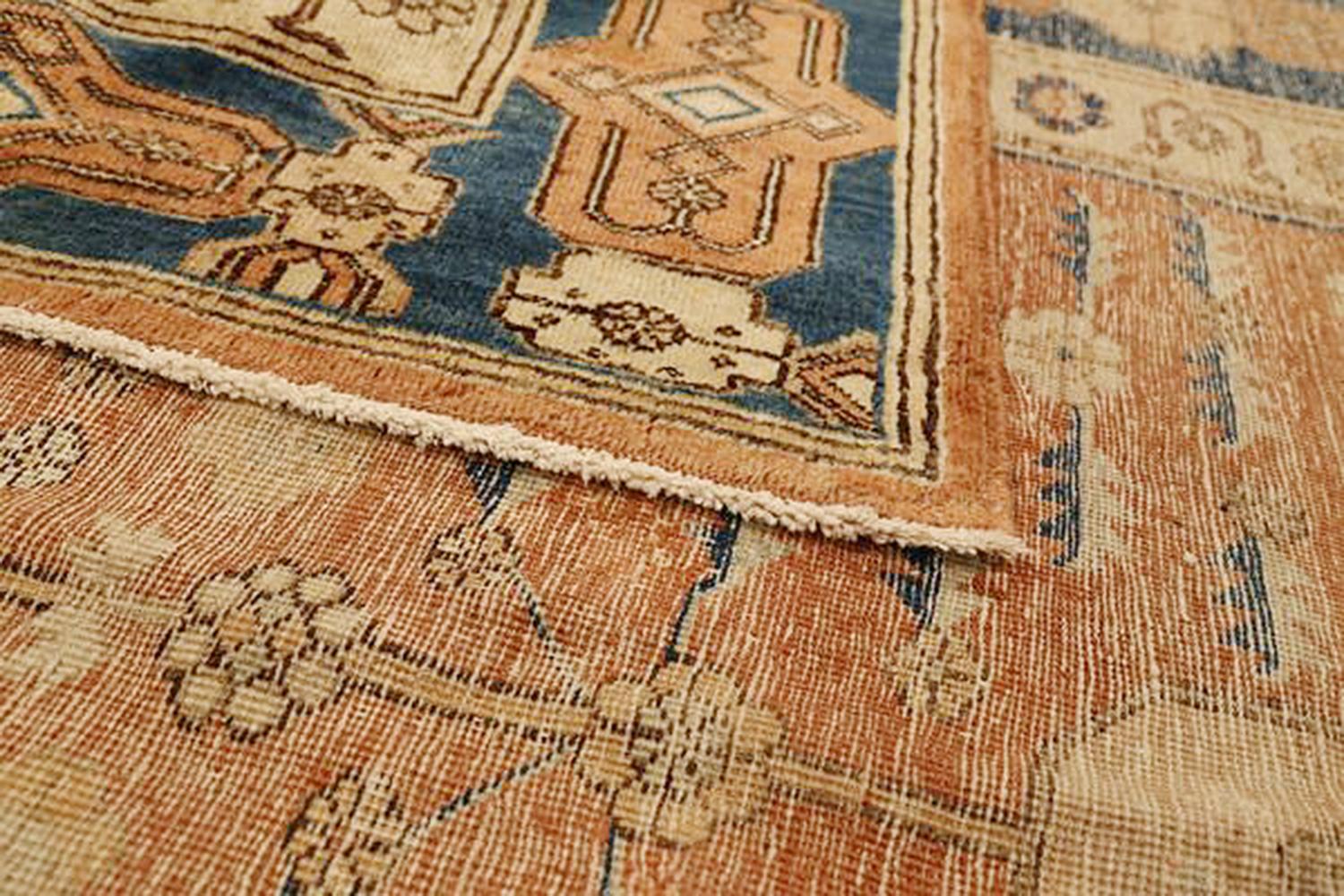 Hand-Woven Antique Russian Khotan Rug with Blue and Beige Floral Patterns on Brown Field For Sale