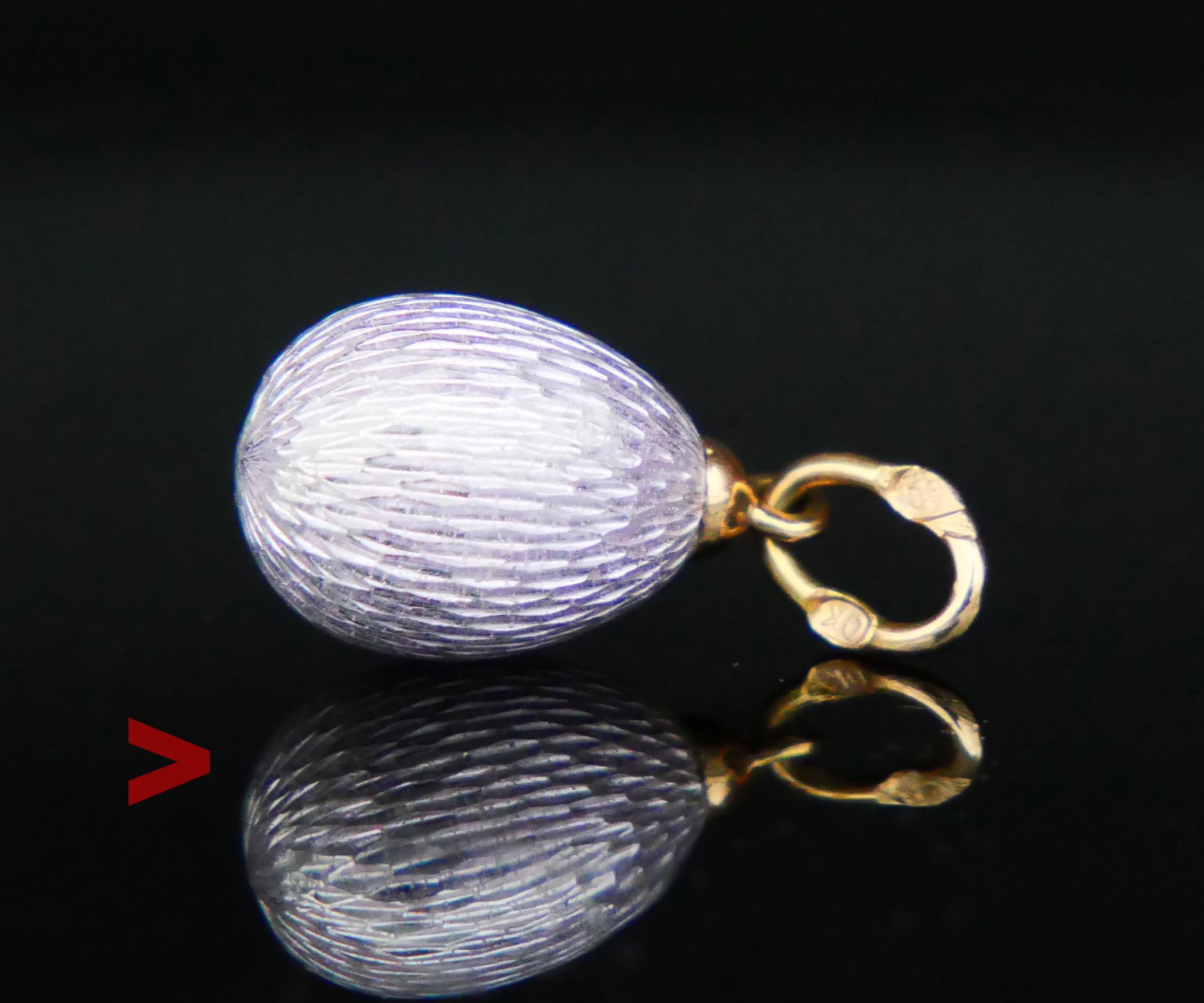 Antique miniature Passover Egg pendant made in Imperial Russia between years 1884 - 1916.

Body in Silver finished with fine translucent Guilloche Lavender toned Enamel and mounted on 14K Gold hanger.

Guilloché is a decorative technique in jewelry