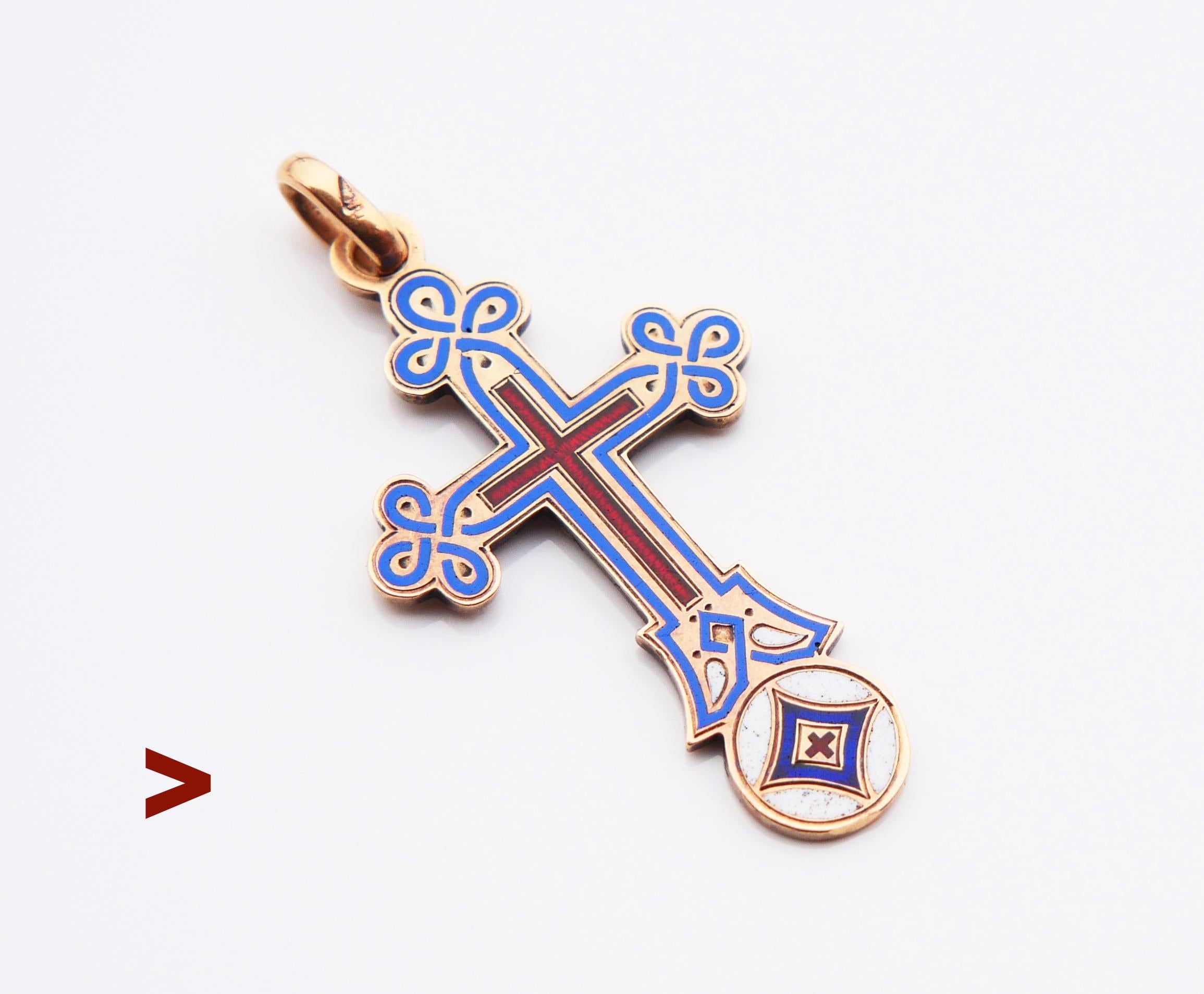 Antique Russian Orthodox Cross pendant in solid 56 / 14K Yellow Gold decorated with Red and Blue Enamels. Traditional inscription in Russian on the back side :  