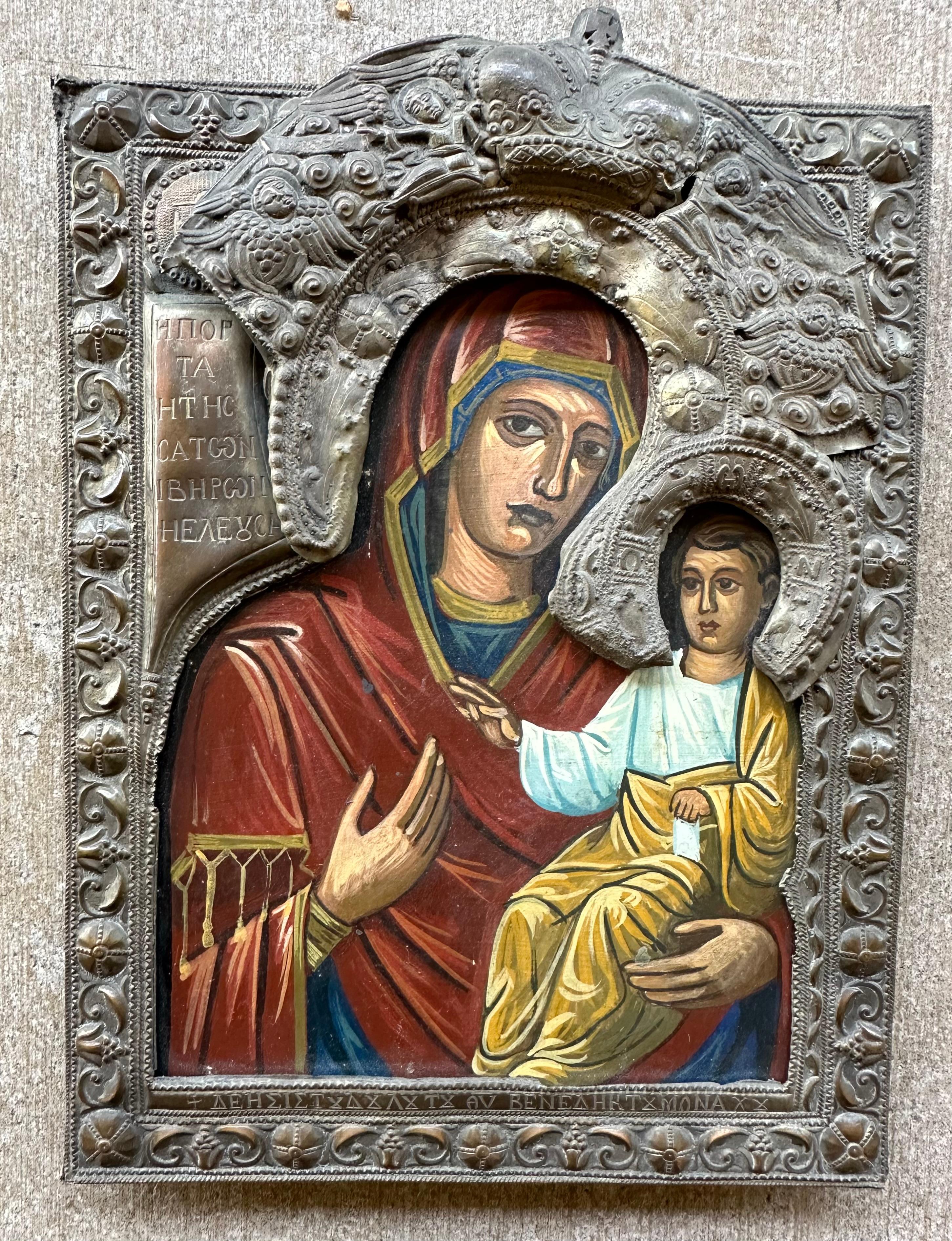 Collectible, hand made and hand-painted, on wooden panel antique Russian Orthodox Icon of Smolensk Mother of God with Metal Basma or Rizza.  The Mother of God of Smolensk is closely associated with a Greek icon of the Hodegetria (She who shows the