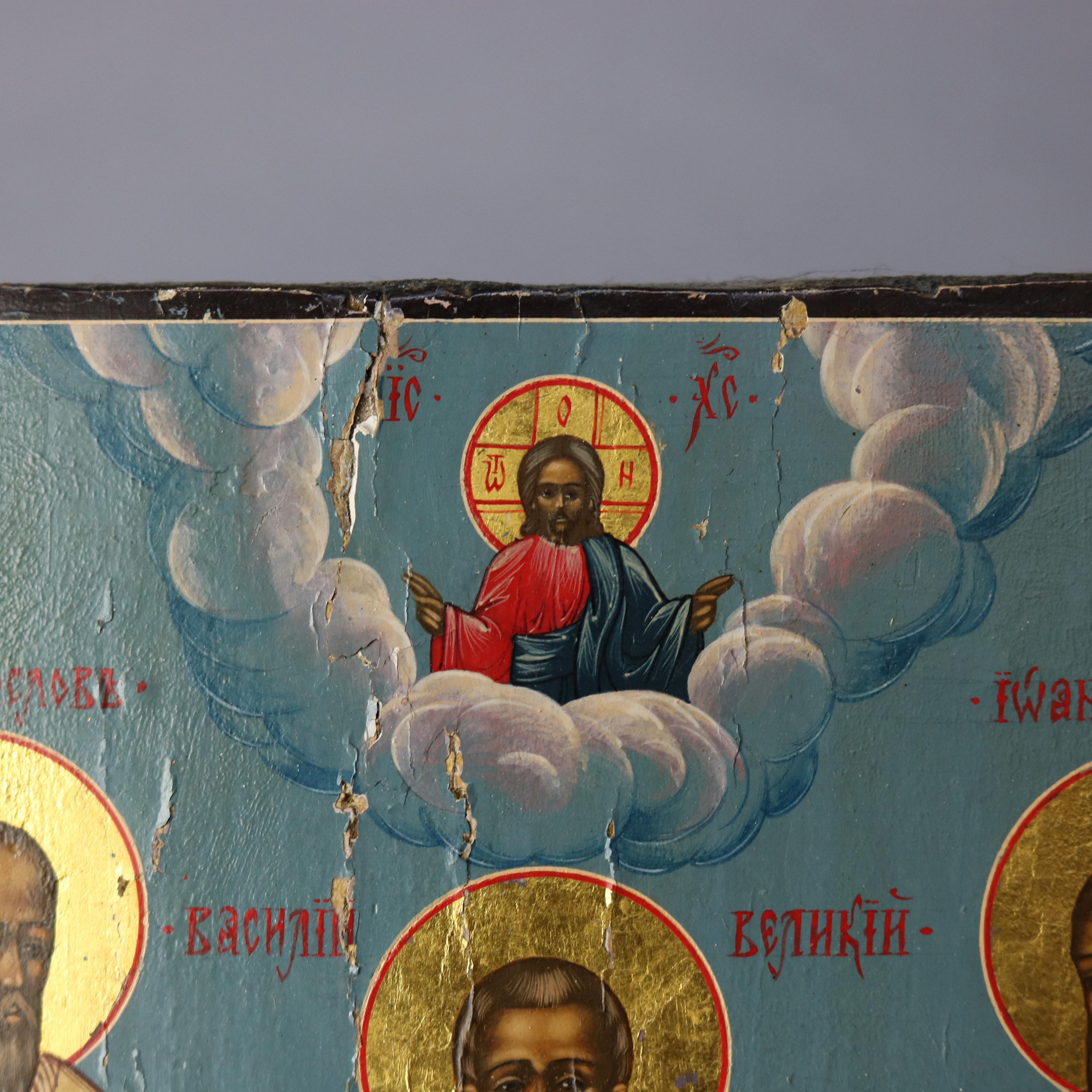 An antique Russian orthodox Icon painting on board depicts Jesus Christ in clouds over three saints, 18th-19th century

Measures: 10.75