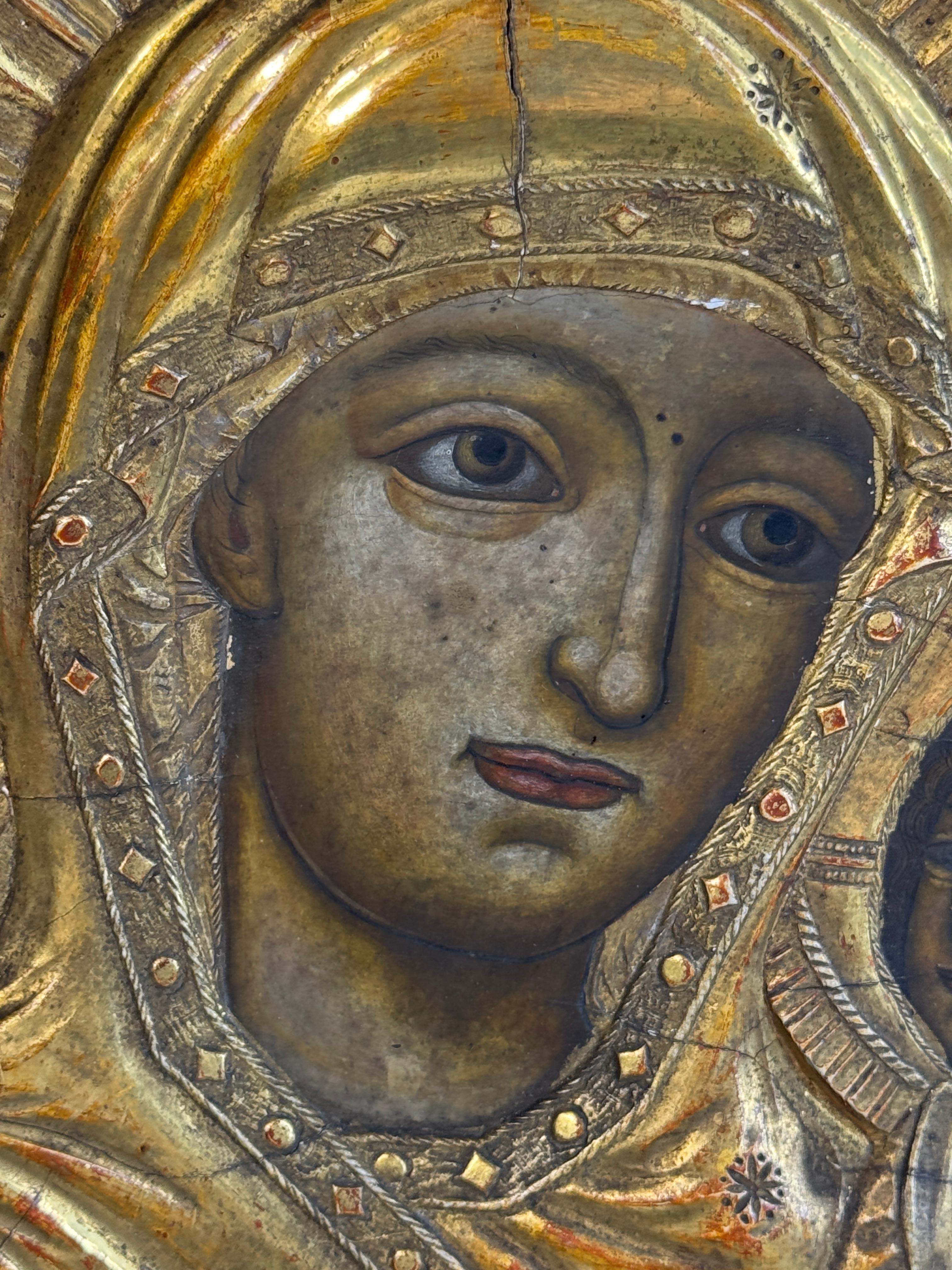 A gorgeous antique titled 17th century Russian icon of Mother of God with Jesus Child in Tikhvinskaya iconography. Mixed media painting: egg tempera, gesso, and levkas on a wood board. Silver Oaklad. Found at an Estate Sale in Vienna, Austria. Nice