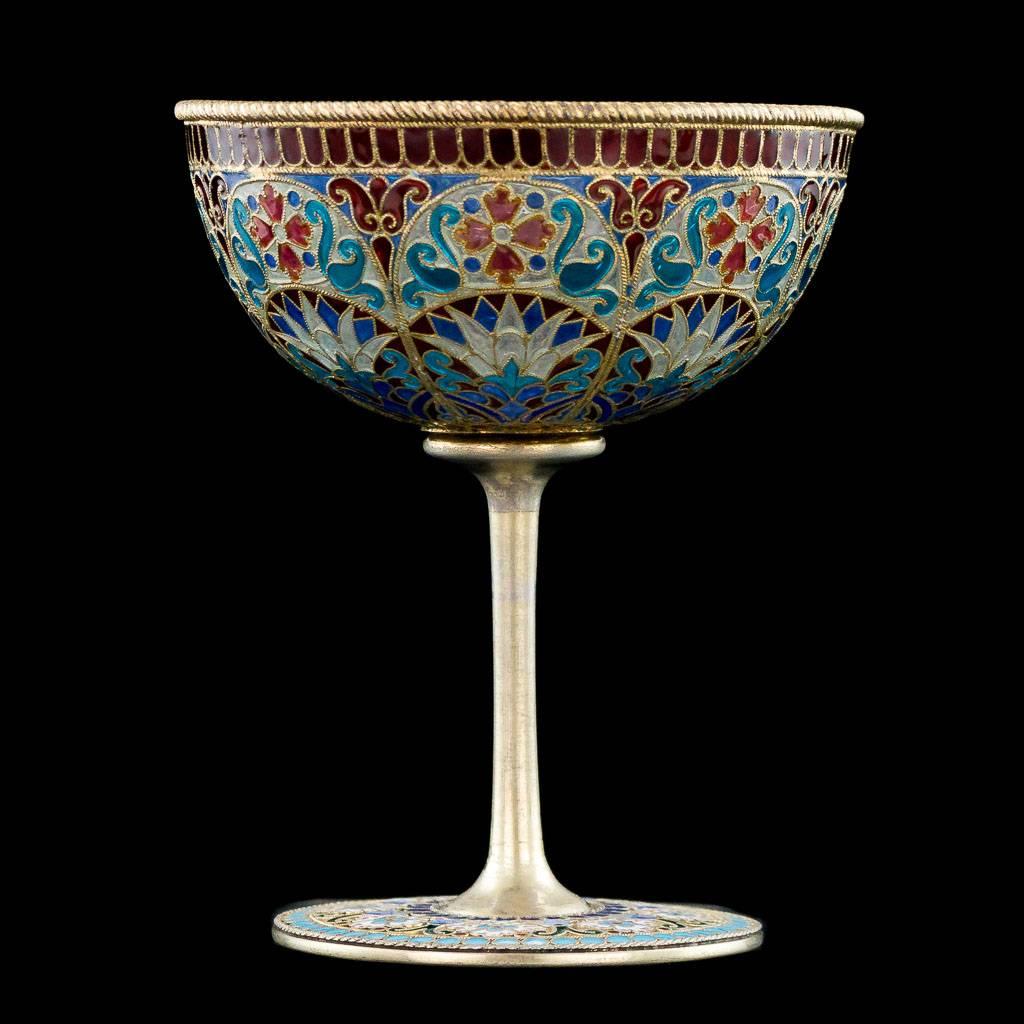 Antique 19th century Imperial Russian solid silver and plique-à-jour enamel sherbet cup, the bowl decorated with polychrome panels of stylized flowers and scrolls in red, blue, purple and white.
Standing on circular foot, enameled with flowers and