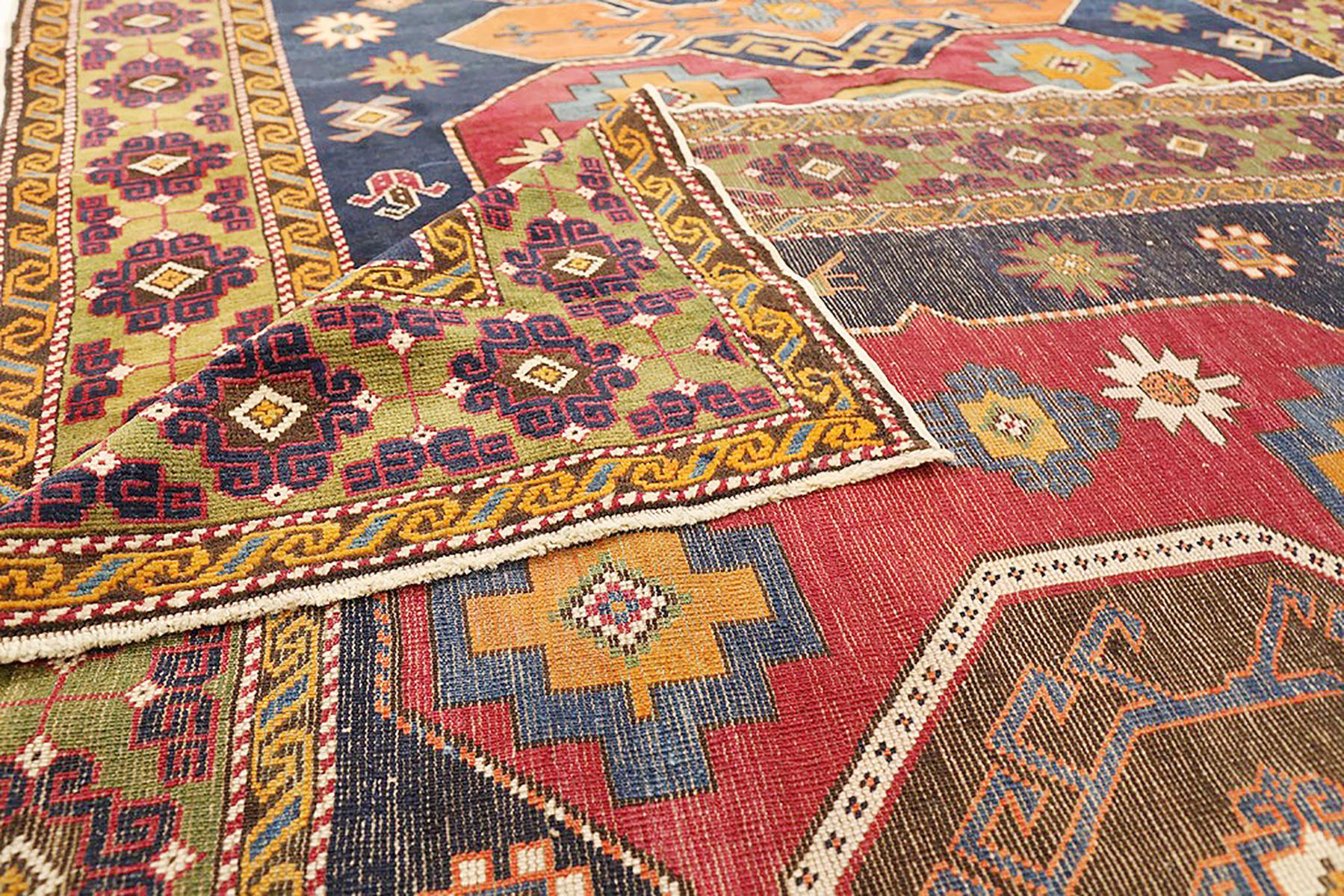 Hand-Woven Antique Russian Shirvan Rug with Geometric & Floral Medallions in Red and Orange For Sale