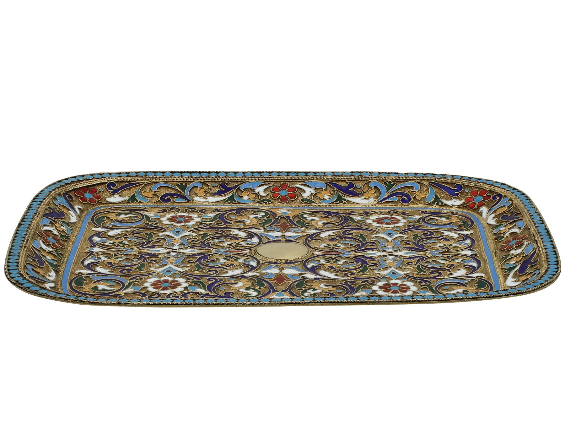 An exceptional, fine and impressive antique Russian silver and polychrome cloisonne enamel tray; an addition to our diverse silver teaware collection.

This exceptional antique Russian silver and enamel tray has a rectangular rounded form.

The