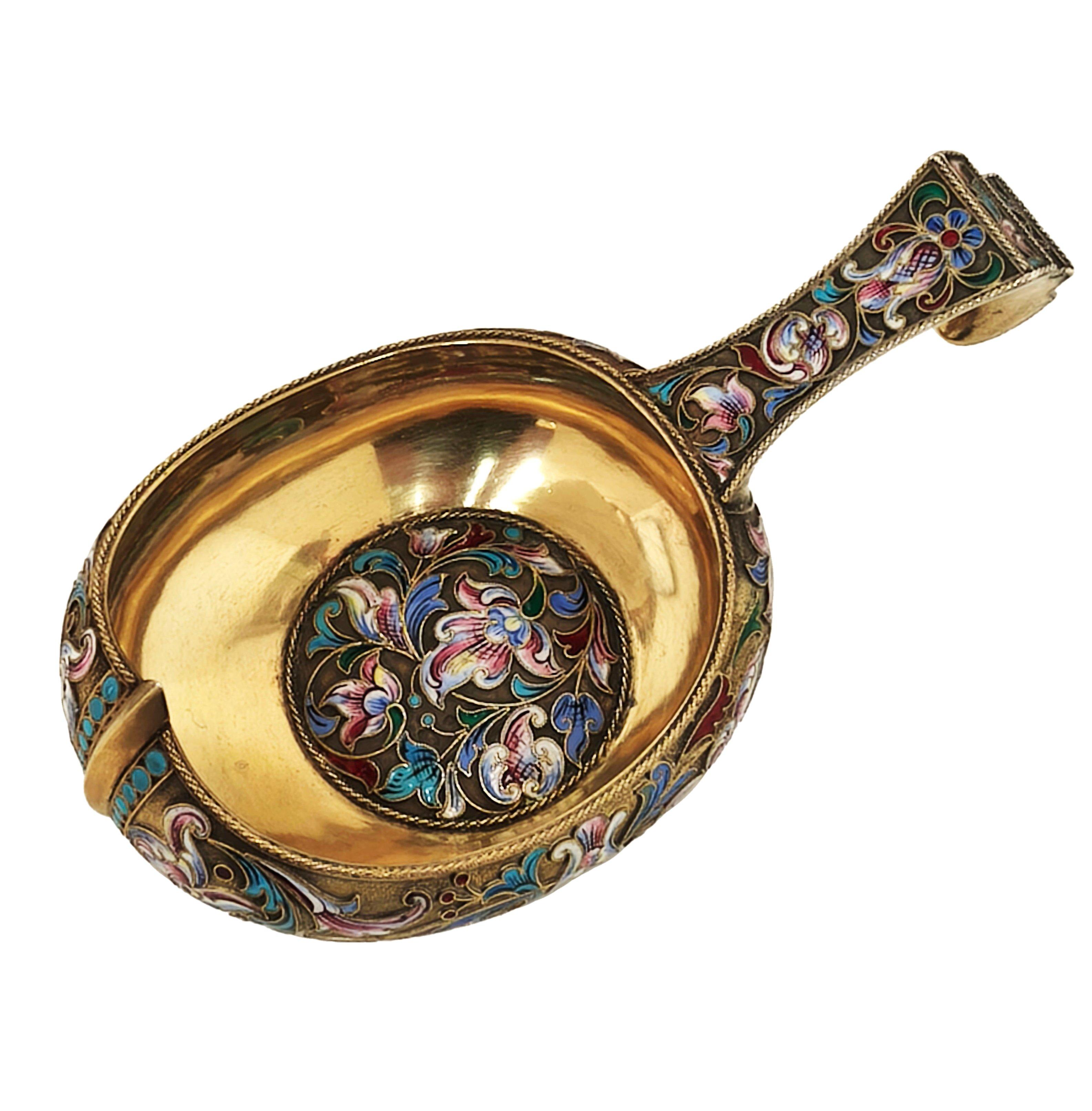 An Antique Russia Silver Gilt & Enamel Kovsh in a traditional form decorated with richly coloured cloisonne enamel forming a stylised floral and foliate design on a gilt background. 

Made in Moscow, Russia in c. 1899 - 1908 by Gustav Klingert. (ГК