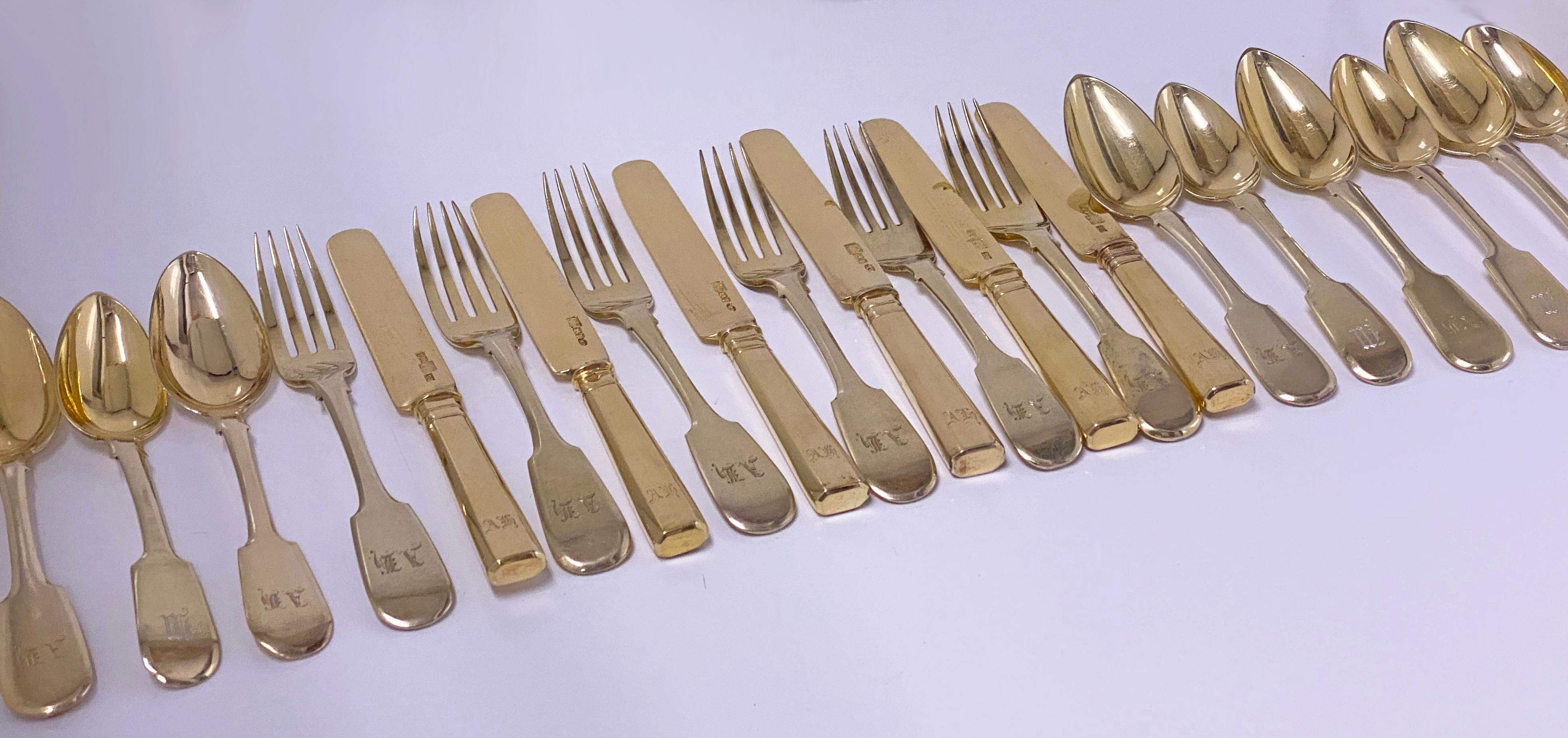 Antique Russian Silver Gilt Lunch Dessert fruit set St Petersburg 1857-61. The set comprising 6 Knives (7.25 inches), 6 forks (6.5 inches), 6 dessert spoons (6.125 inches) and 5 teaspoons (5.75 inches). Each with initial AB or M. 5 larger spoons