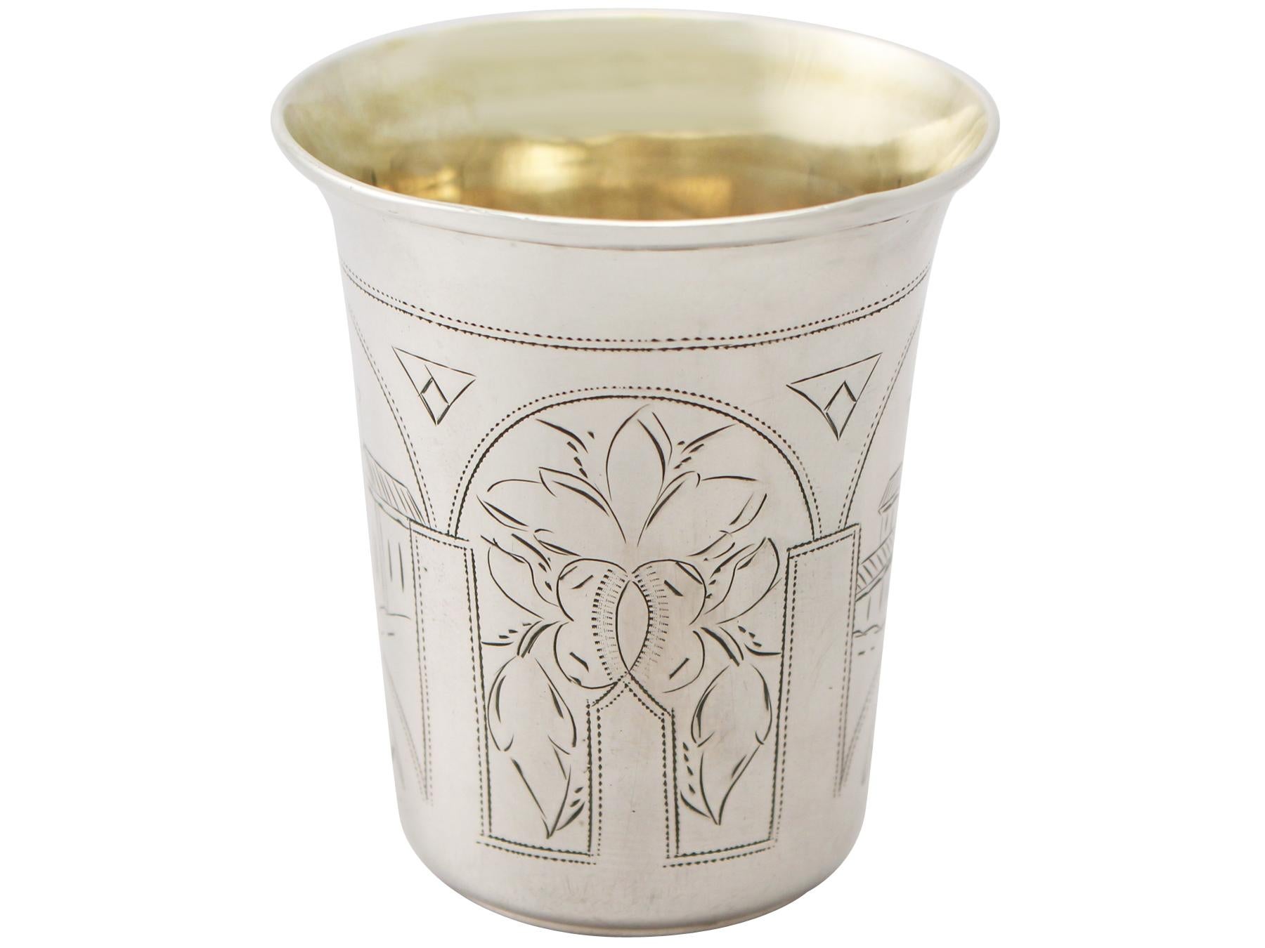 A fine and impressive antique Russian silver Kiddush cup / beaker; an addition to our range of drinks related silverware

This fine antique Russian silver Kiddush cup / beaker has a cylindrical tapering form onto a collet style base.

The surface of