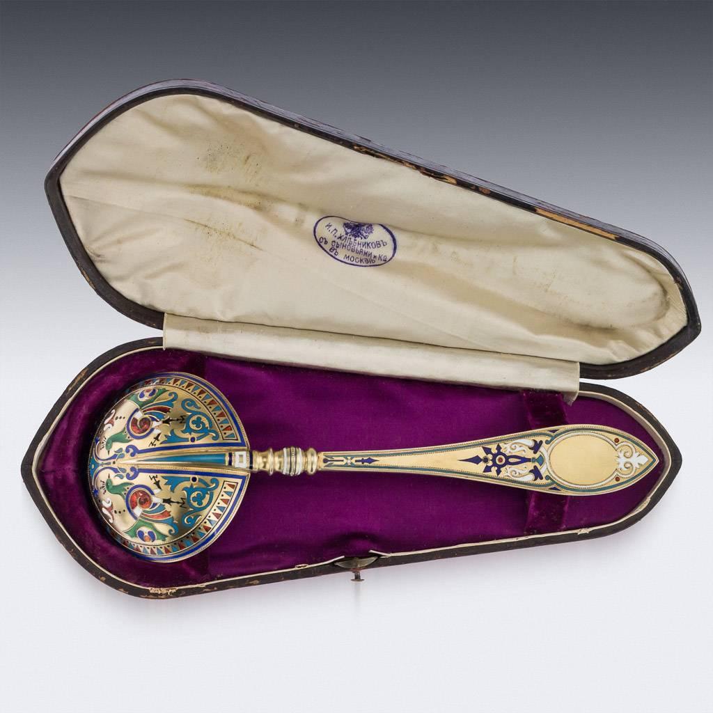 Antique 19th century Russian pan-Slavic solid silver-gilt and cloisonne' enamel large caviar serving spoon, the round bowl is applied on reverse with multicolored champlevé enamel scrolls and cockerels on matted silver gilt ground withing blue and