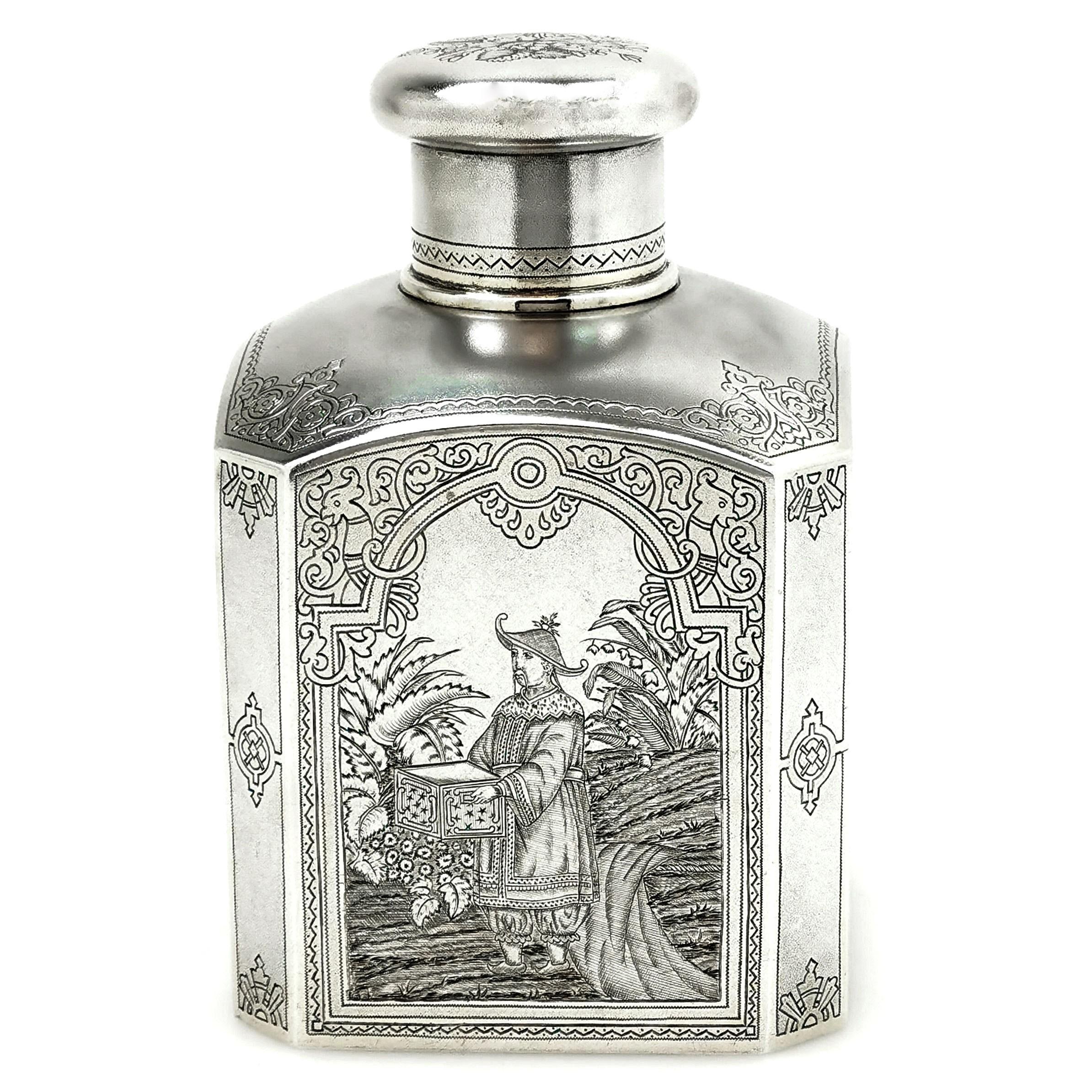 A beautiful Antique Russian Solid Silver Tea Caddy decorated with beautiful Chinoiserie Style images. The square cut corner Tea Caddy has an engraved Chinese / Asian Style image on each side as well as decorative borders and an floral engraving on