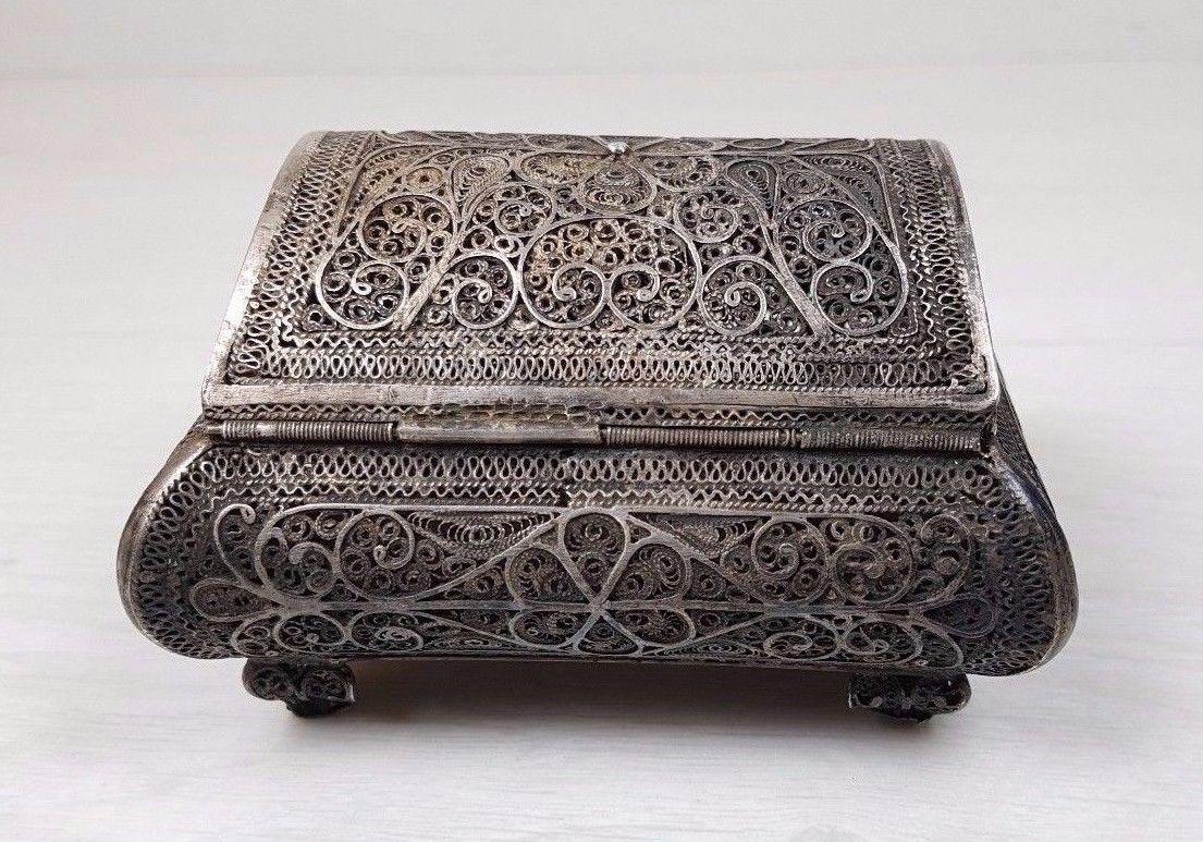 A handmade filigree trinket box - jewelry box - case. This is a unique Russian Filigree Handwork. The legend tells that creating such a piece of art takes the master about 350 days. It is dated between 1878-1900. The material which it is made of is