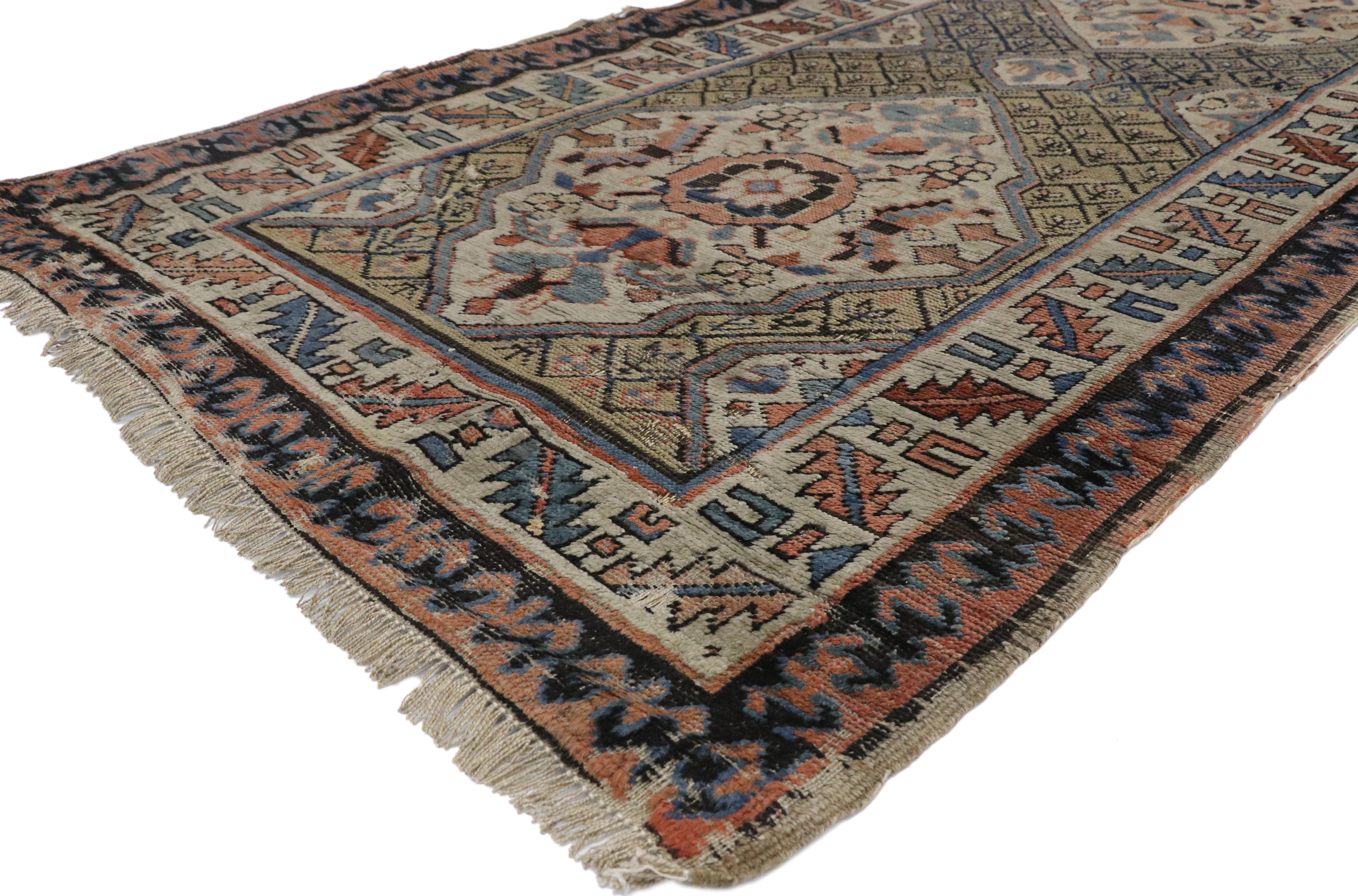 77058 Distressed Antique Russian Tribal Kazak Rug, Caucasian Hallway Runner 03'02 x 11'05. This hand-knotted wool antique Russian Kazak runner features three large scale lozenge motifs filled with stylized florals and animal motifs formed from