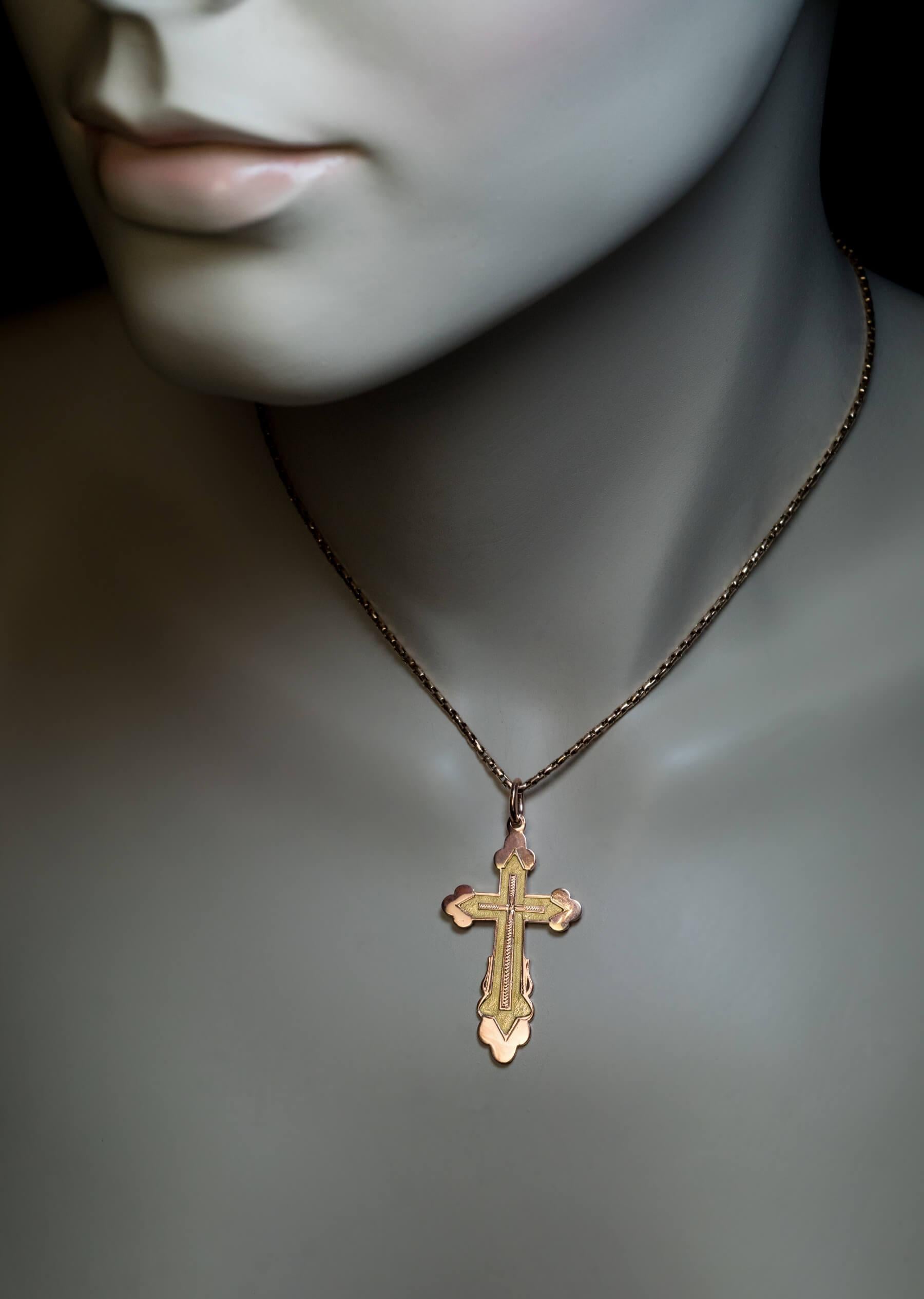 Made in Moscow between 1908 and 1917.  The cross is finely crafted in polished rose and textured yellow 14K gold.  The engraved inscription on the back in Old Slavonic script reads: SAVE AND PROTECT.  Marked with maker’s initials, 56 zolotnik old
