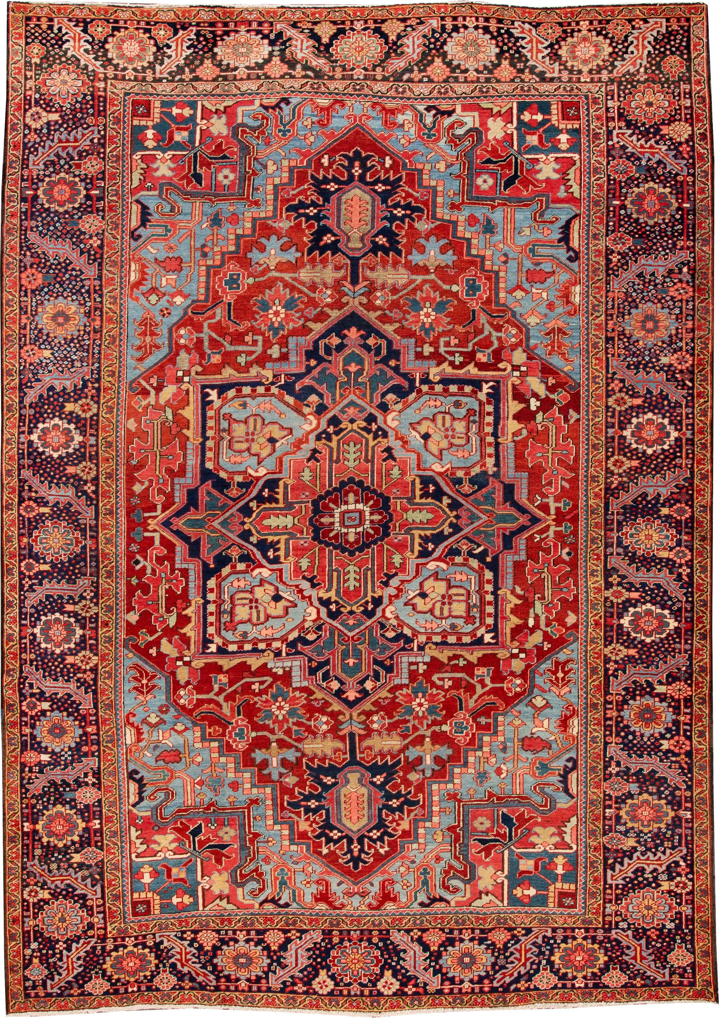 Beautiful vintage hand-knotted Persian Heriz wool rug with a rusted field and multicolor accents featuring a gorgeous all-over traditional medallion design. 

This rug measures: 8'10