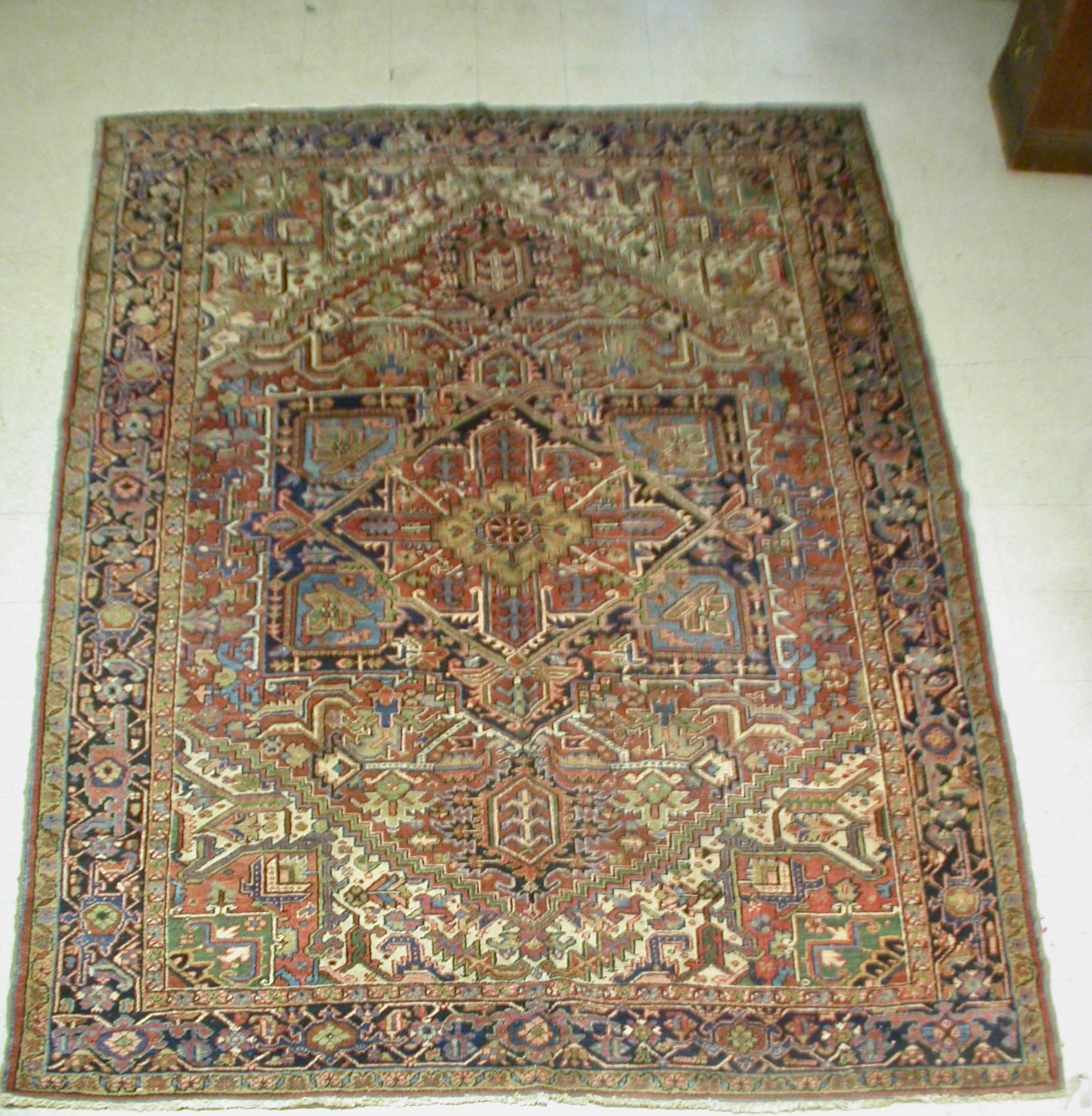 Heriz Serapi Antique Rust Navy Blue Geometric Tribal Persian Heriz Rug, circa 1920s For Sale