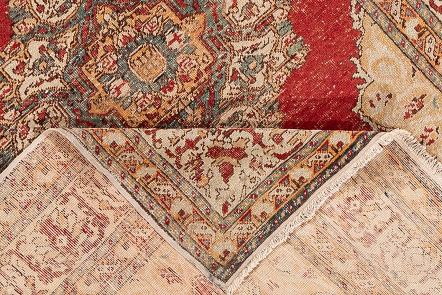 Beautiful antique Oushak hand knotted wool rug with a red and beige field. This Oushak has a designed frame with peach and gray accents in all over the medallion floral design.

This rug measures 4'0