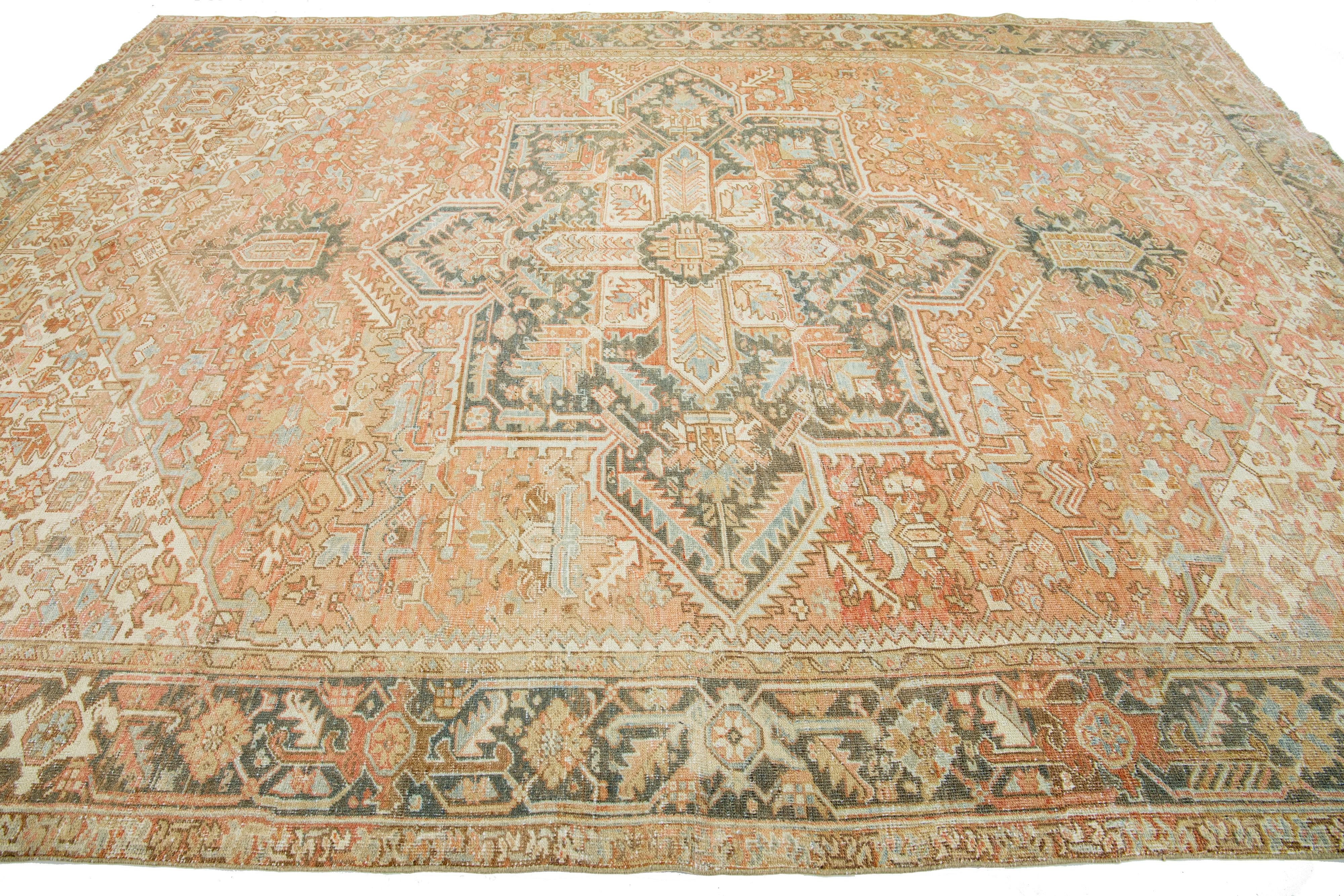 Hand-Knotted Antique Rust Persian Heriz Wool Rug Featuring a Medallion Motif For Sale