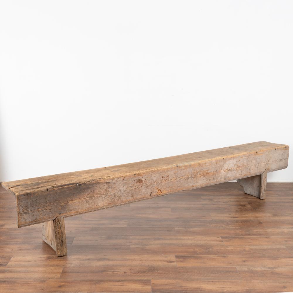 Rustic long oak Swedish country bench loaded with aged character and soft weathered patina.
Restored, sanded strong and level. Ready to be used and enjoyed. 
Any scratches, cracks, dings, or old stains reflect the generations of use and simpy add
