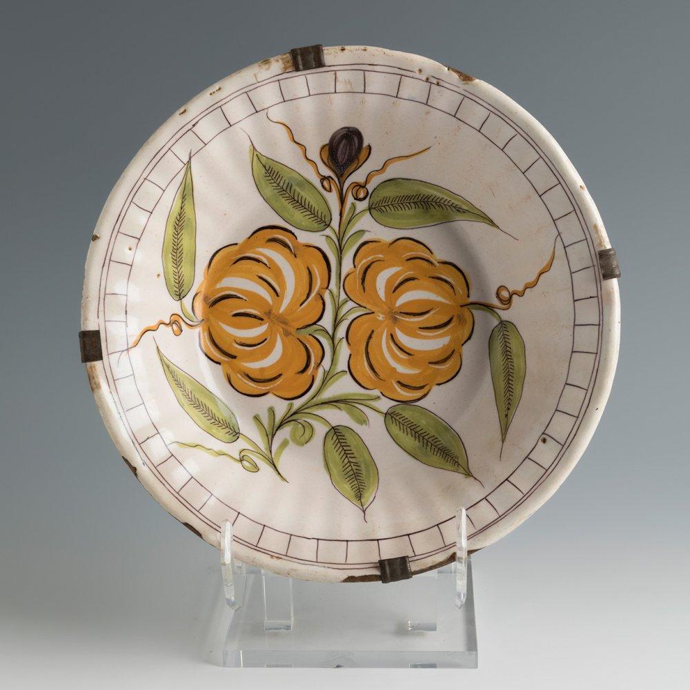 Anonymous
Valencia (probably Manises), Spain; 19th century
Ceramic

Approximate size: 10.6 (diameter) x 2.75 (depth) inches

A lovely polychrome ceramic plate probably made in Manises, famed for its production of distinctive Spanish pottery. The