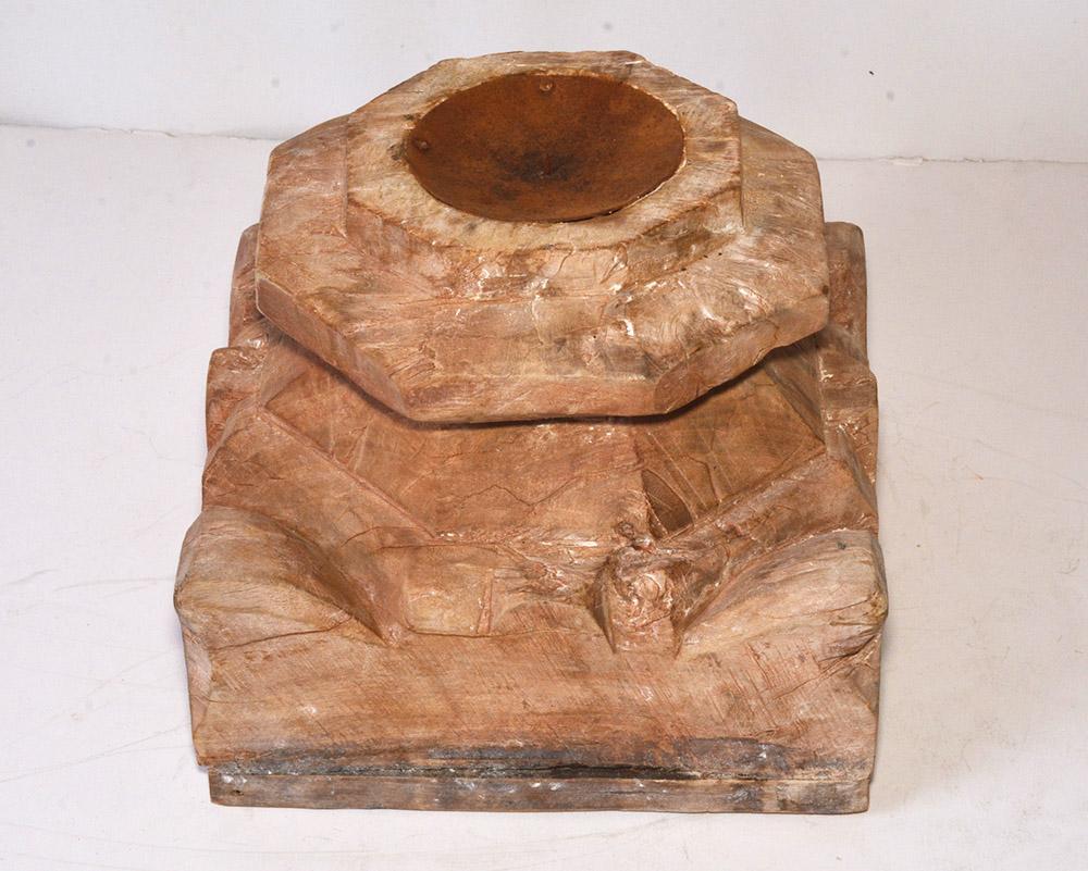 The large sculptural antique rustic Anglo-Indian candleholder made from architectural element. Carved hardwood with an indented metal disk and spike or pricket for candles with extra-large diameters. Great center piece for a table.