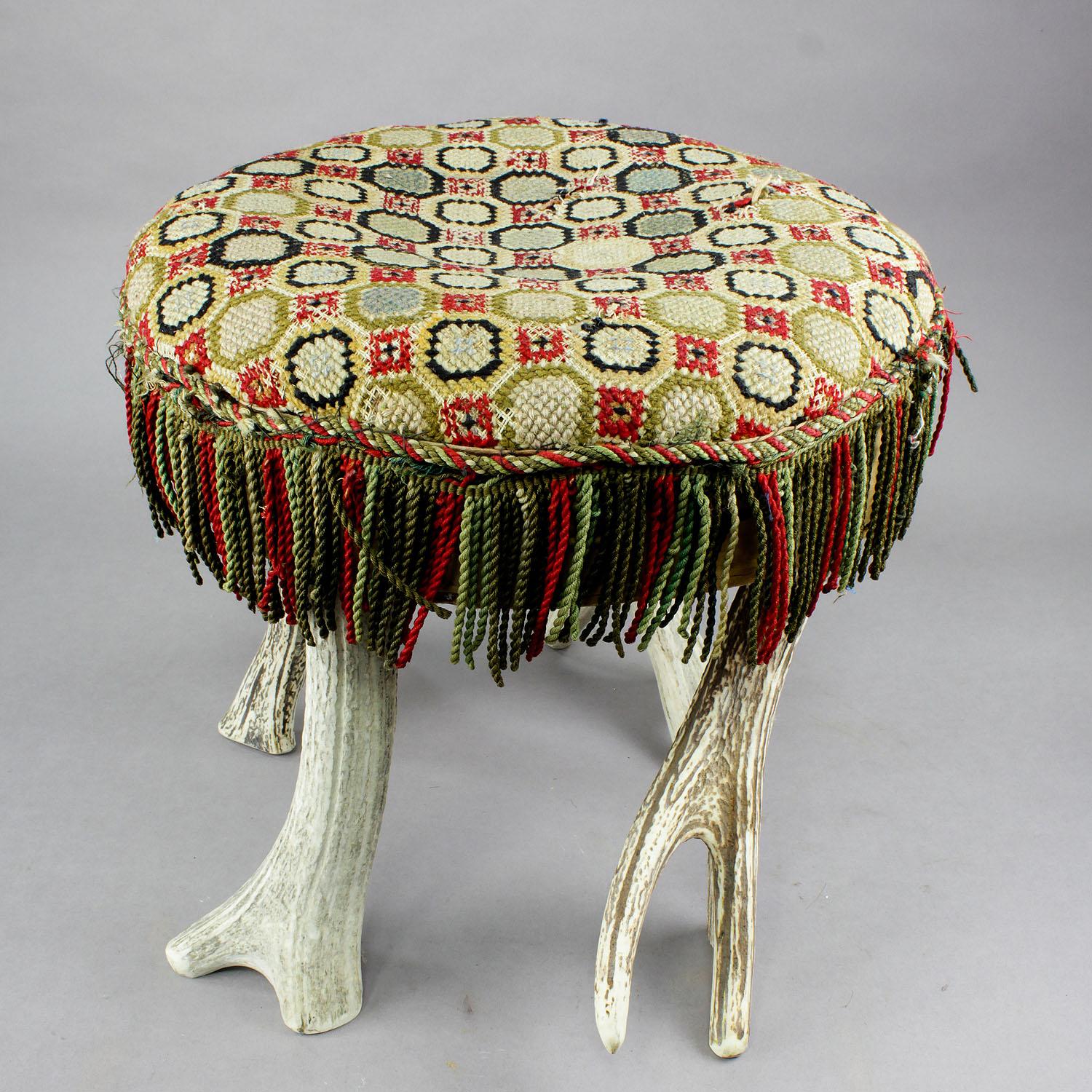 An antique antler stool with stag antlers as legs, seat with handwoven canvas. germany, Black Forest, circa 1900

Measures: Height 17.32