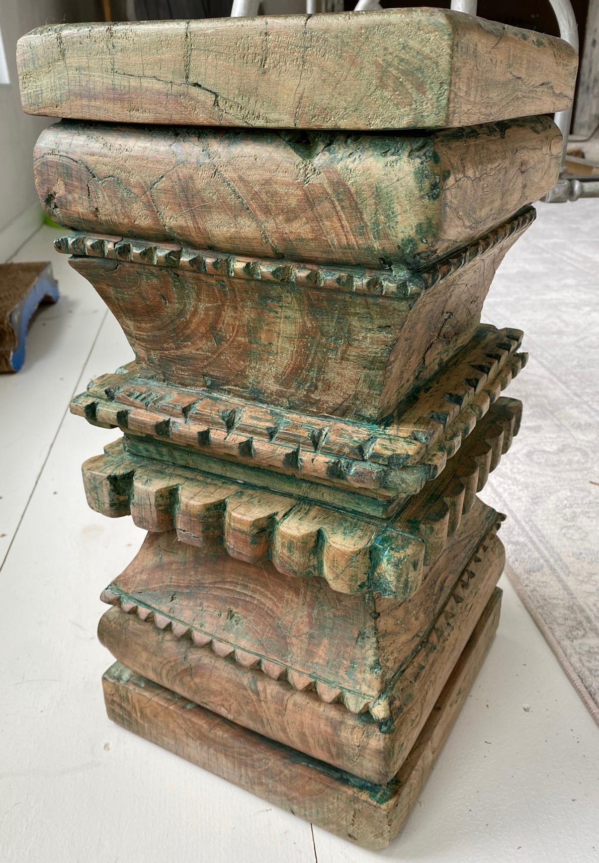 Indian carved wood pedestal, plinth, table bases or stools. Beautifully hand carved with wonderful wood patina showing paint remnant giving them wonderful interest and character. Once part of a column, reduced to a size usable as end tables,