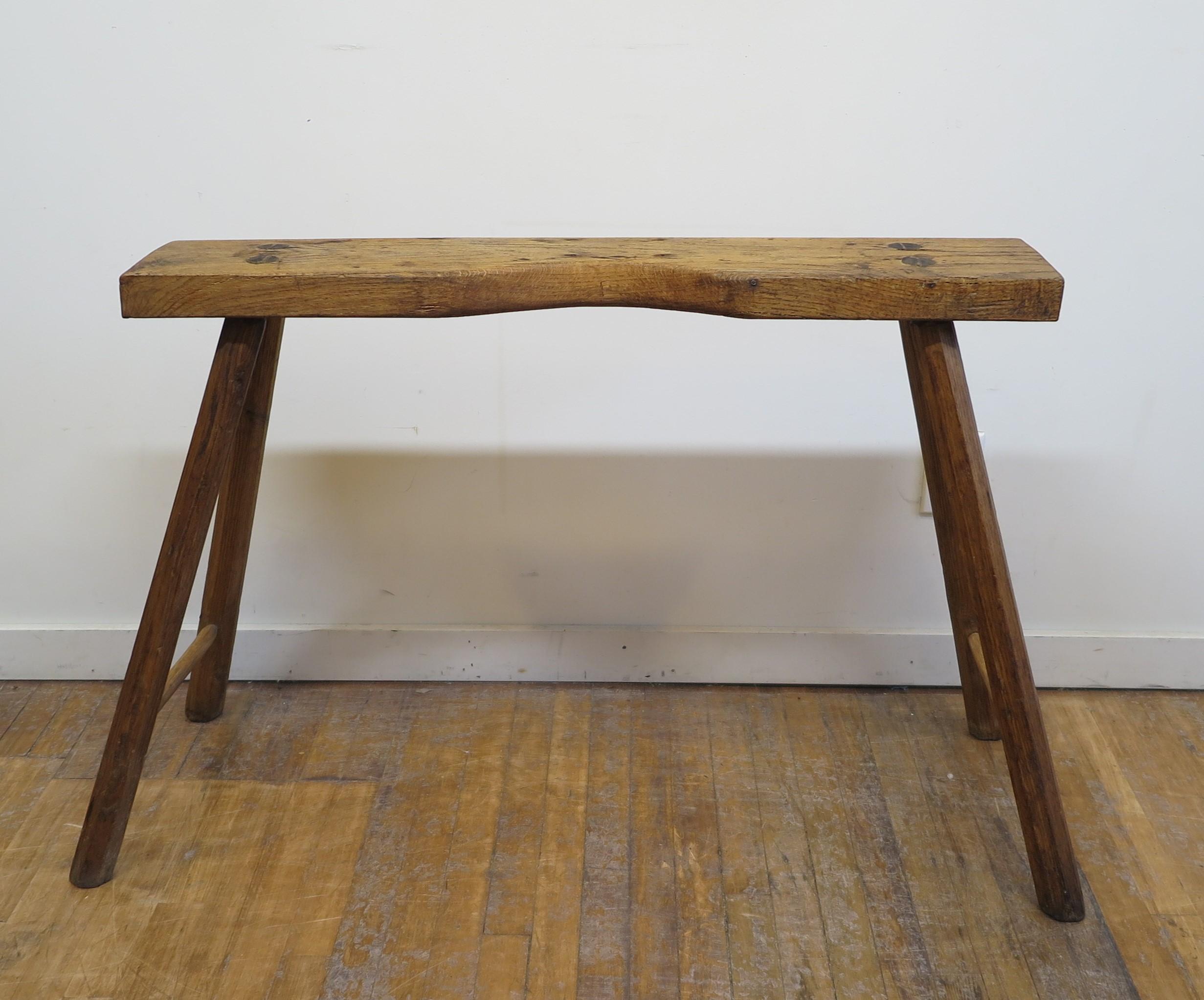 American Rustic console table. A primitive American Rustic Console Table set on splayed legs. Fantastic antique primitive table with carve out for work station. This fabulous table is all hand cut and shaped wood, you can see and feel the