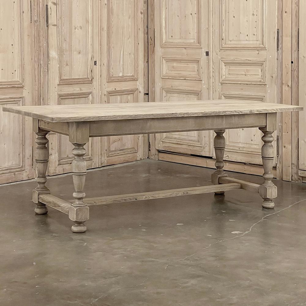 Antique Rustic Country French Farm Table ~ Dining Table was crafted entirely from solid oak and features a thick plank top supported by a structure consisting of more planks used for an apron, and four heavy turned posts serving as legs.  The