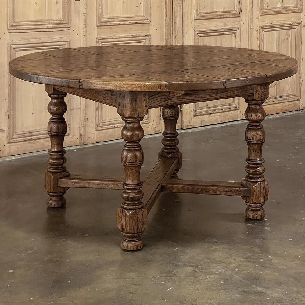 Antique Rustic Country French Round Dining Table will make the perfect choice for a cozy dining room, bay window, or a breakfast room!  The top is comprised of thick planks of solid old-growth oak, with a solid oak apron and four turned columns