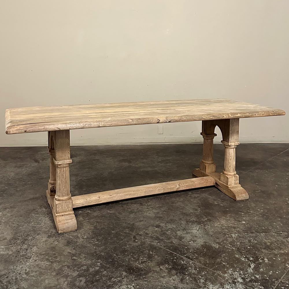 Antique Rustic Country French Trestle Table with Columns was fashioned from dense, old-growth timbers and planks of solid oak, designed to literally last for centuries!  The thick plank top does not require an apron support, enhancing knee