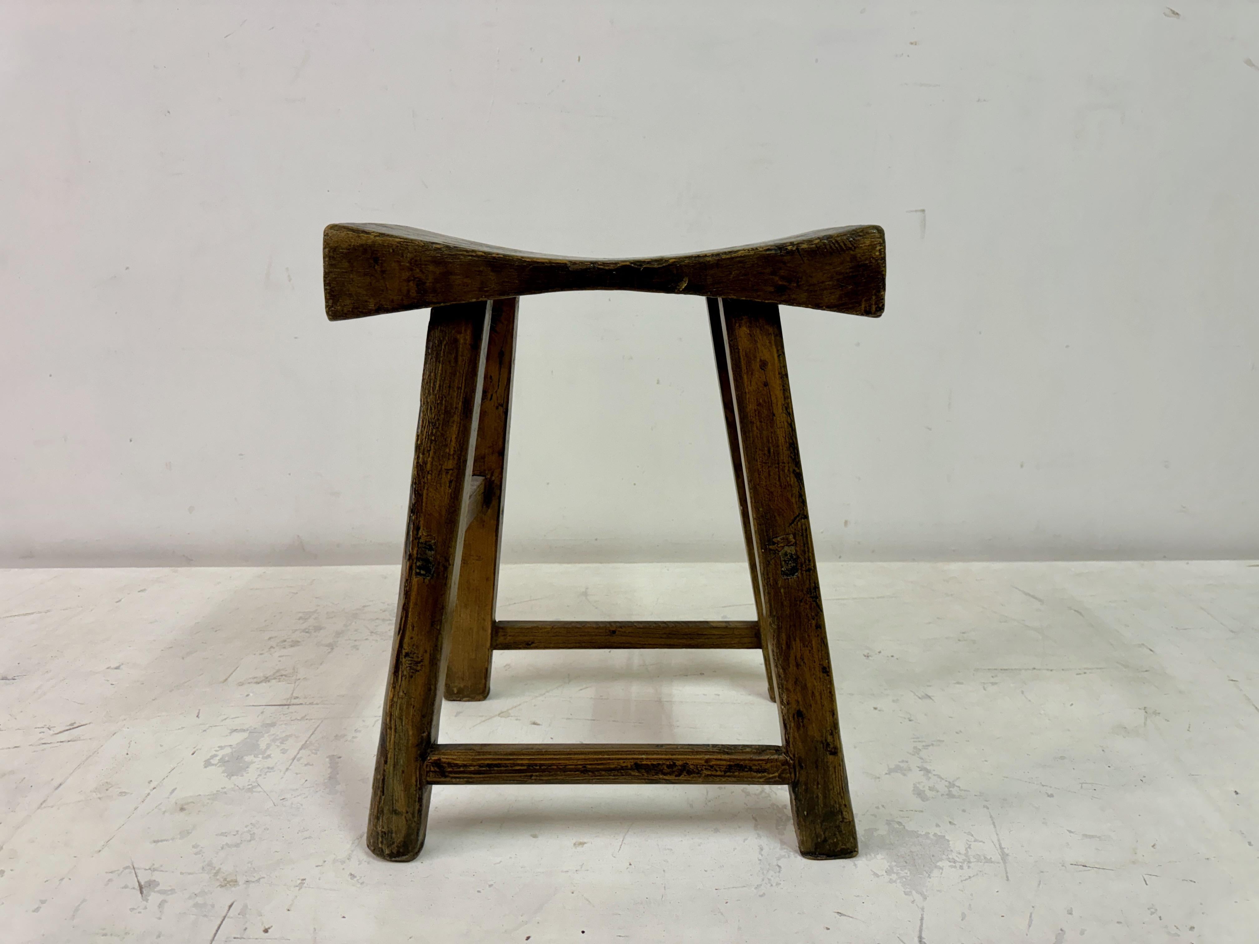 Rustic stool

Elm

Visible joints

Great patina

This is a rustic wooden stool with a traditional handcrafted design, showcasing its natural charm and functionality. The seat features a slightly curved and weathered surface, adding comfort and
