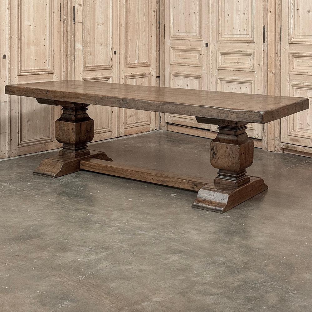 Antique Rustic European Double Pedestal Trestle Dining Table was literally built to last for centuries!  Hand-crafted from dense, old-growth seasoned oak, its thick plank top with dovetailed joints is so strong a supporting apron is unnecessary,