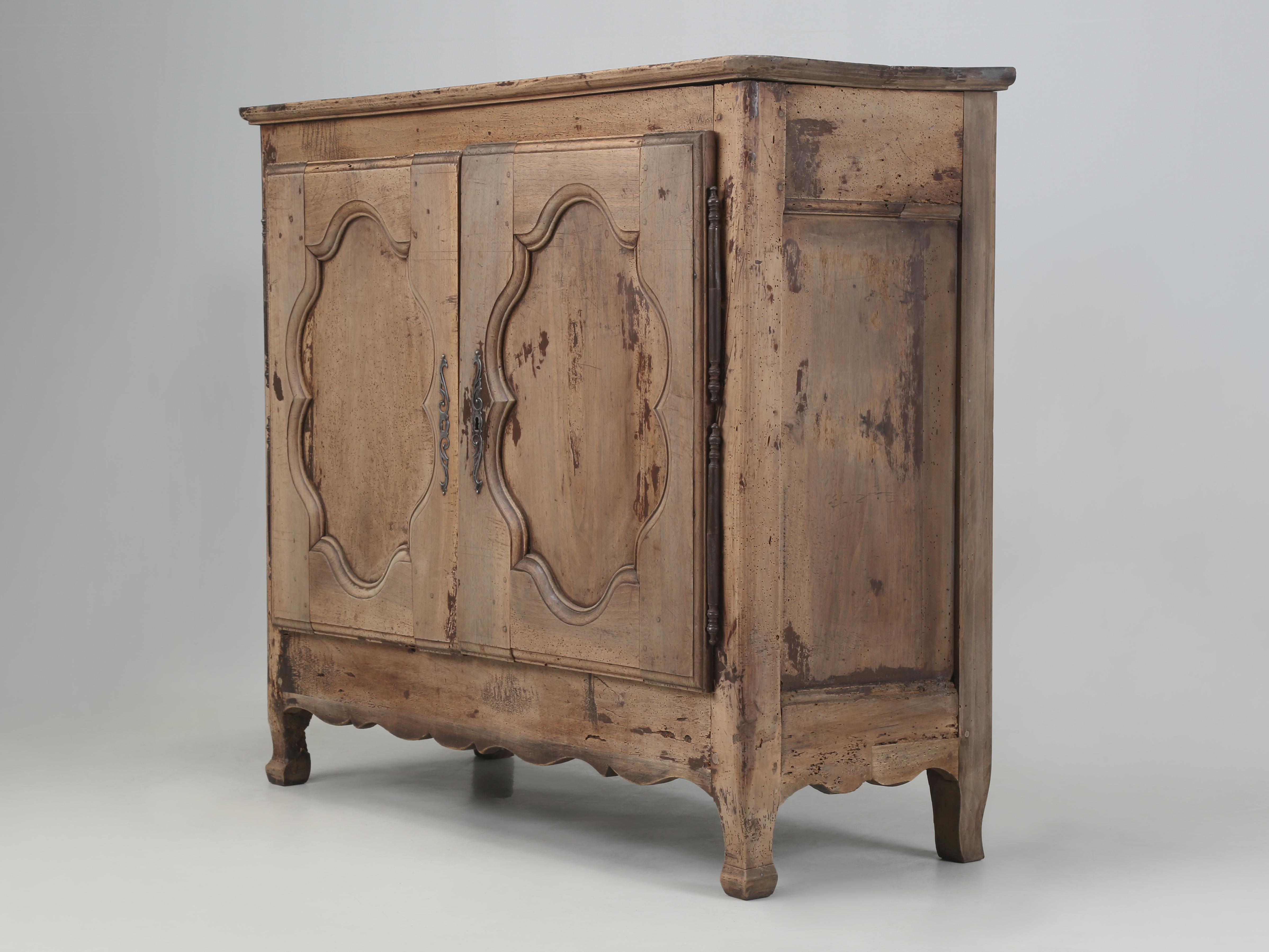 Antique Rustic French Buffet that was rebuilt structurally and left cosmetically original. Based on the construction techniques and saw marks we are reasonably confident that this Antique French Buffet dates from the mid-1700's. Generally we do not