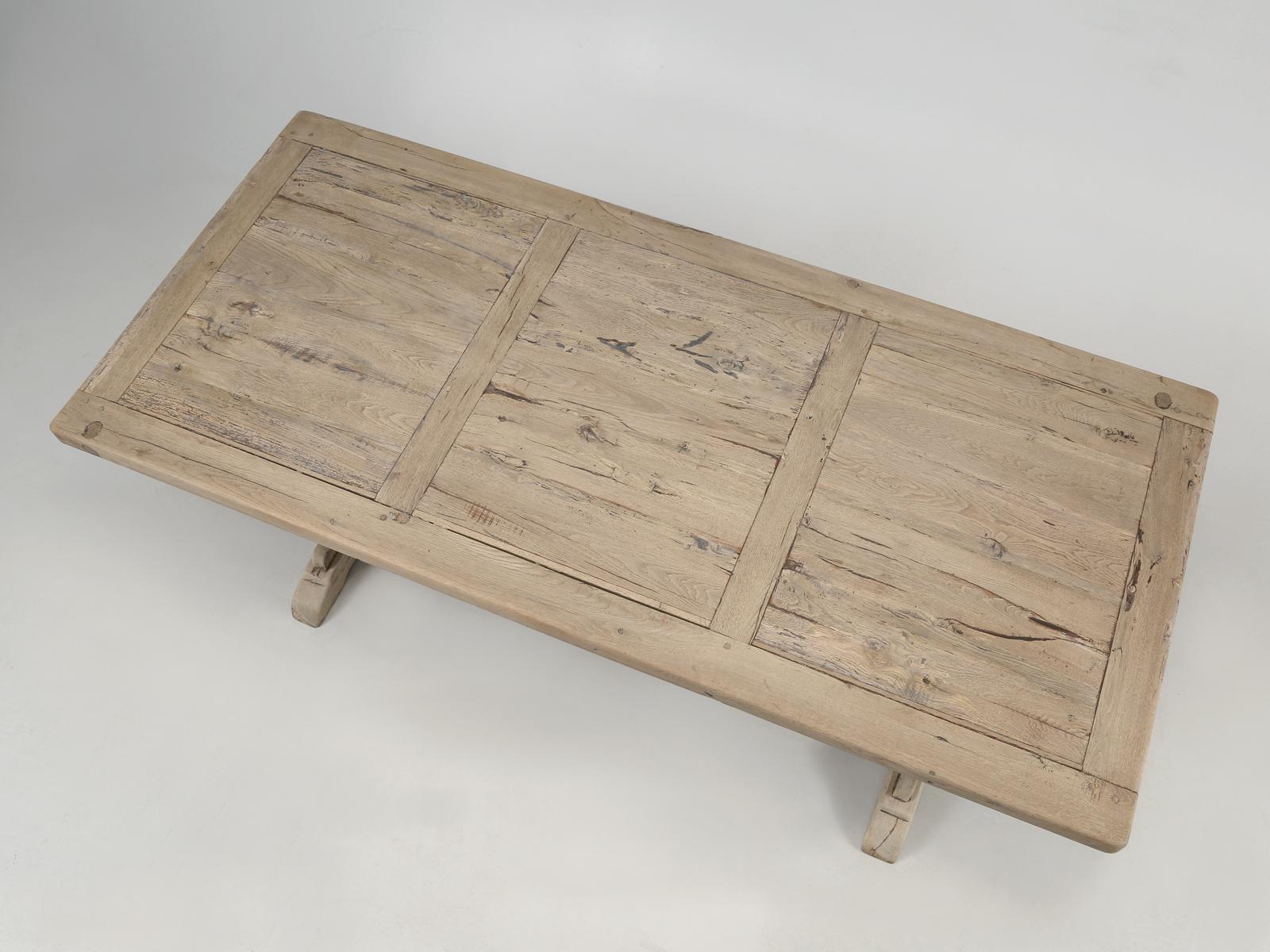Rustic French white oak farm table, kitchen table or dining table in its natural unrestored state. Although structurally sound, cosmetically it was left original and should you want it refinished, we are only too happy to accommodate. The rustic