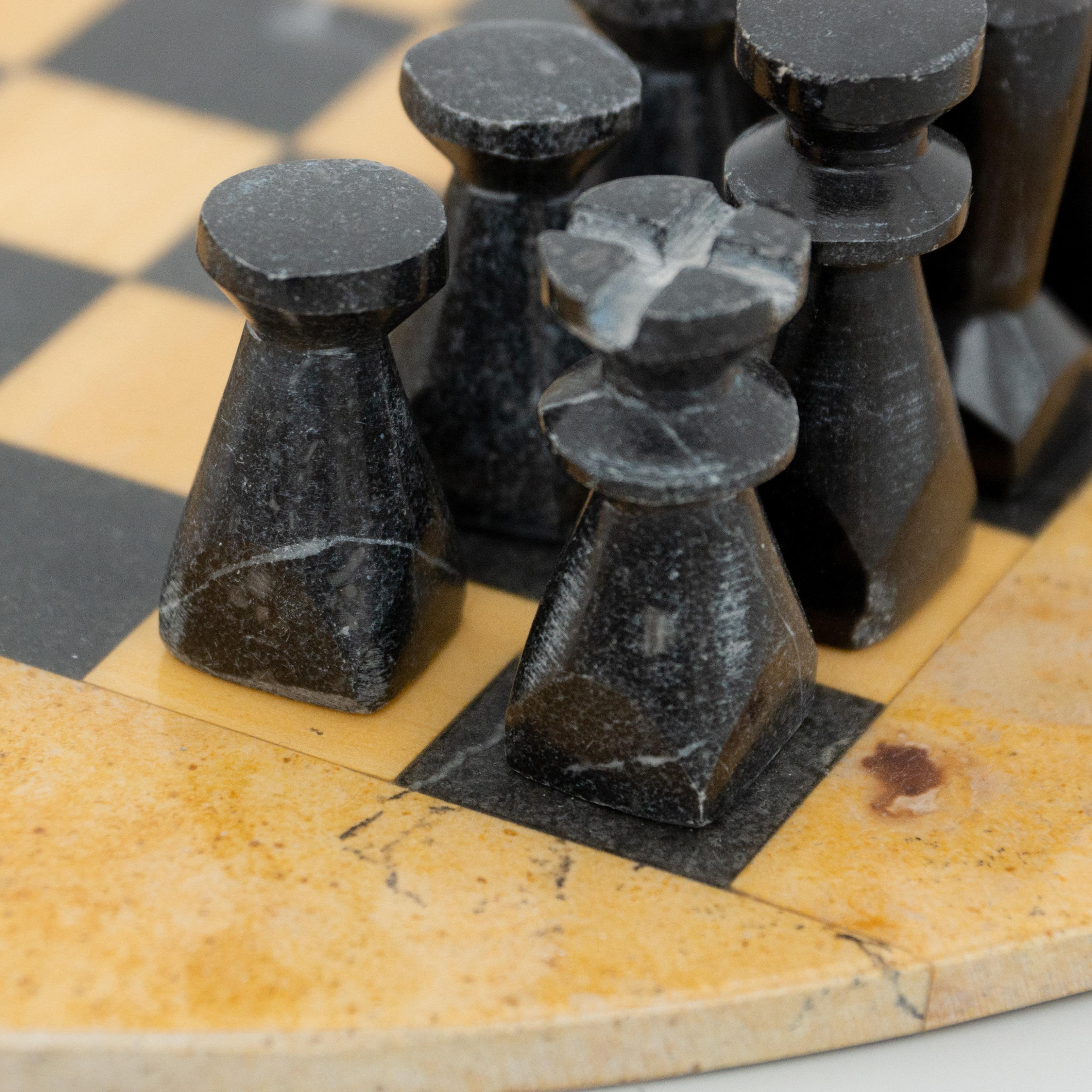 Antique rustic stone chess.
By unknown manufacturer from France, circa 1940.

In original condition, with minor wear consistent with age and use, preserving a beautiful patina.

Material:
Stone

Dimensions:
ø 34 cm x H 6.8 cm.