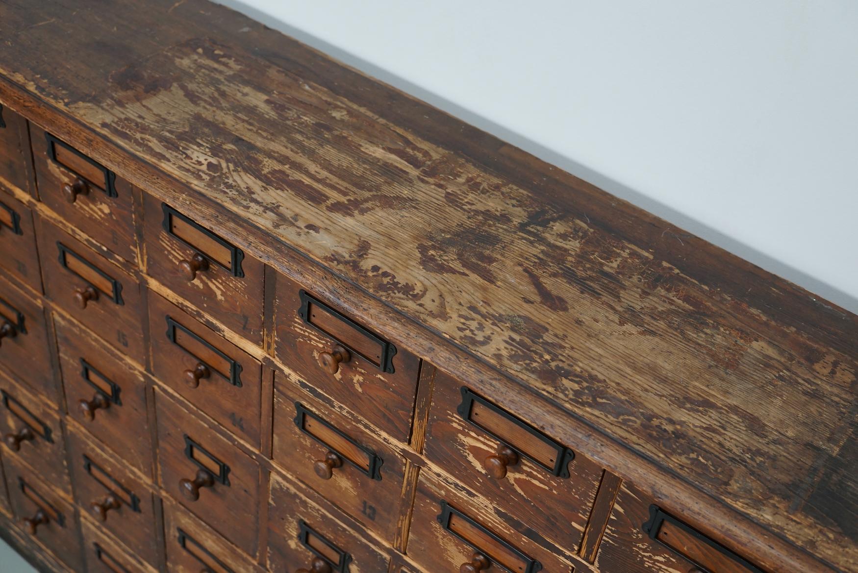 20th Century Antique Rustic German Pine Apothecary Cabinet / Bank of Drawers, Early 20thc
