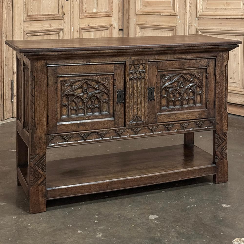Antique Rustic Gothic Console ~ Raised Cabinet recalls a style that dates back over a thousand years!  A solid plank top is edged with an angled bevel with a tier of molding connecting to the top of the cabinet.  The cabinet features a pair of