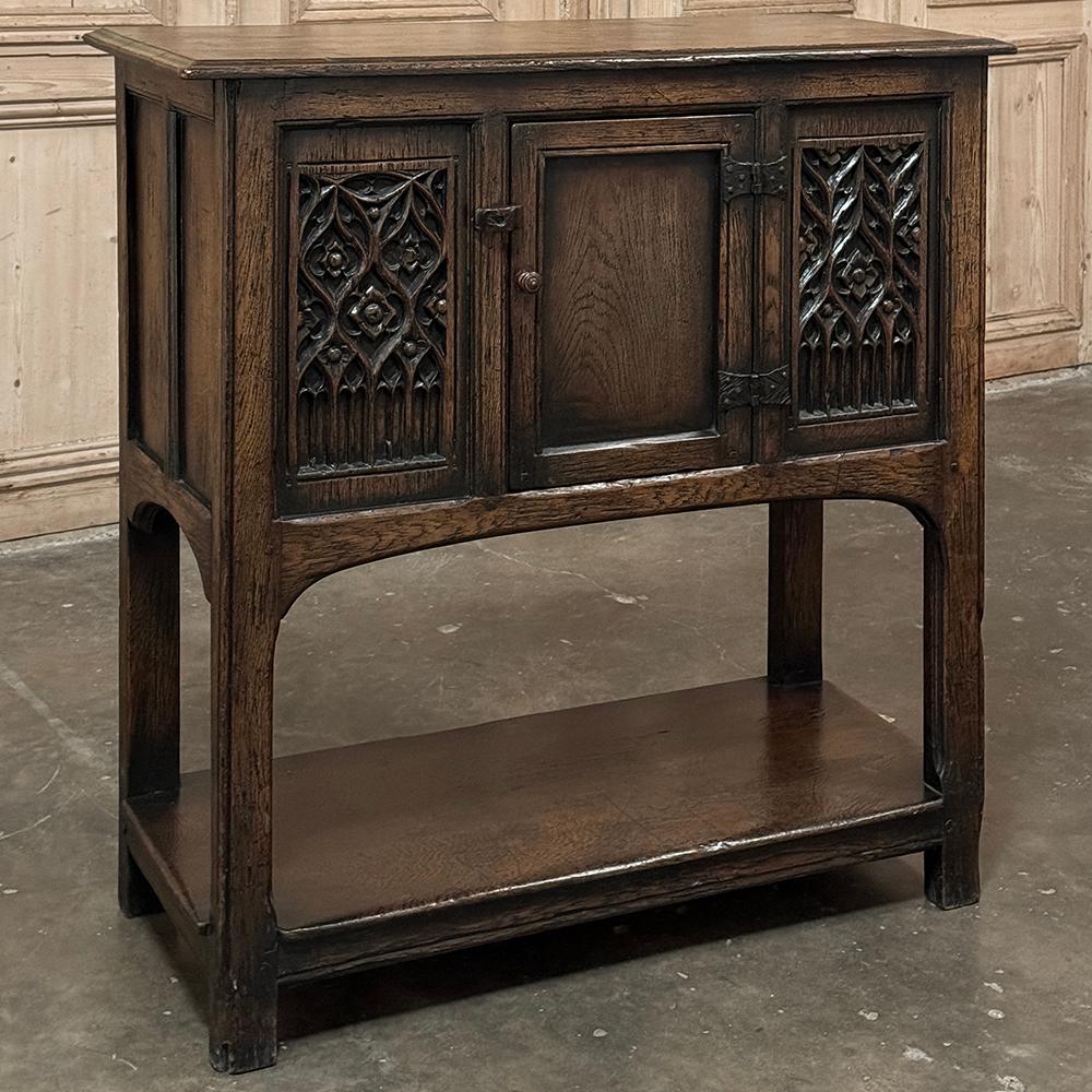 Antique Rustic Gothic Petite Raised Cabinet is the perfect choice for a cozy home, a small niche, under the stairwell or anywhere a diminutive yet timelessly stylish cabinet works.  Hand-crafted from solid oak, it features steel strap hinges, and