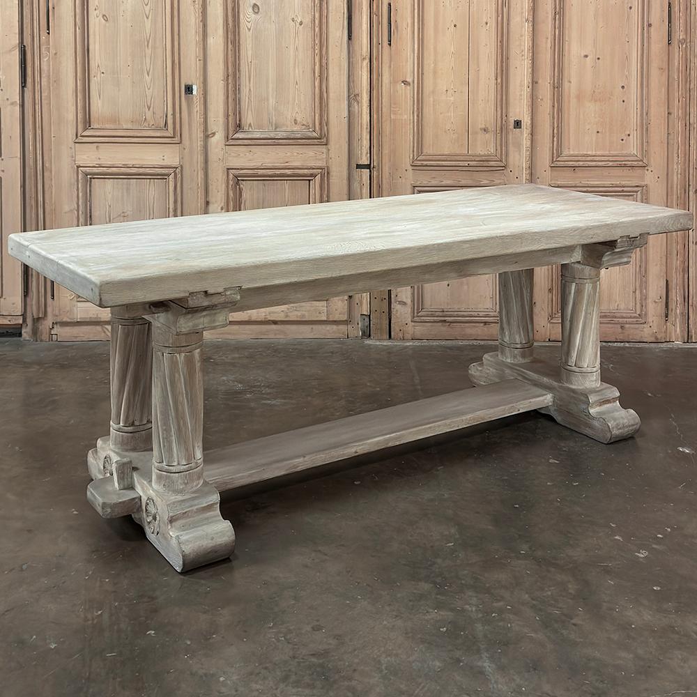 Antique Rustic Gothic Whitewashed Oak Dining Table was literally designed to last for centuries!  Hand-crafted from thick, solid planks of old growth oak, it features time-honored mortise & tenon joinery and a trestle design with four spiral-fluted