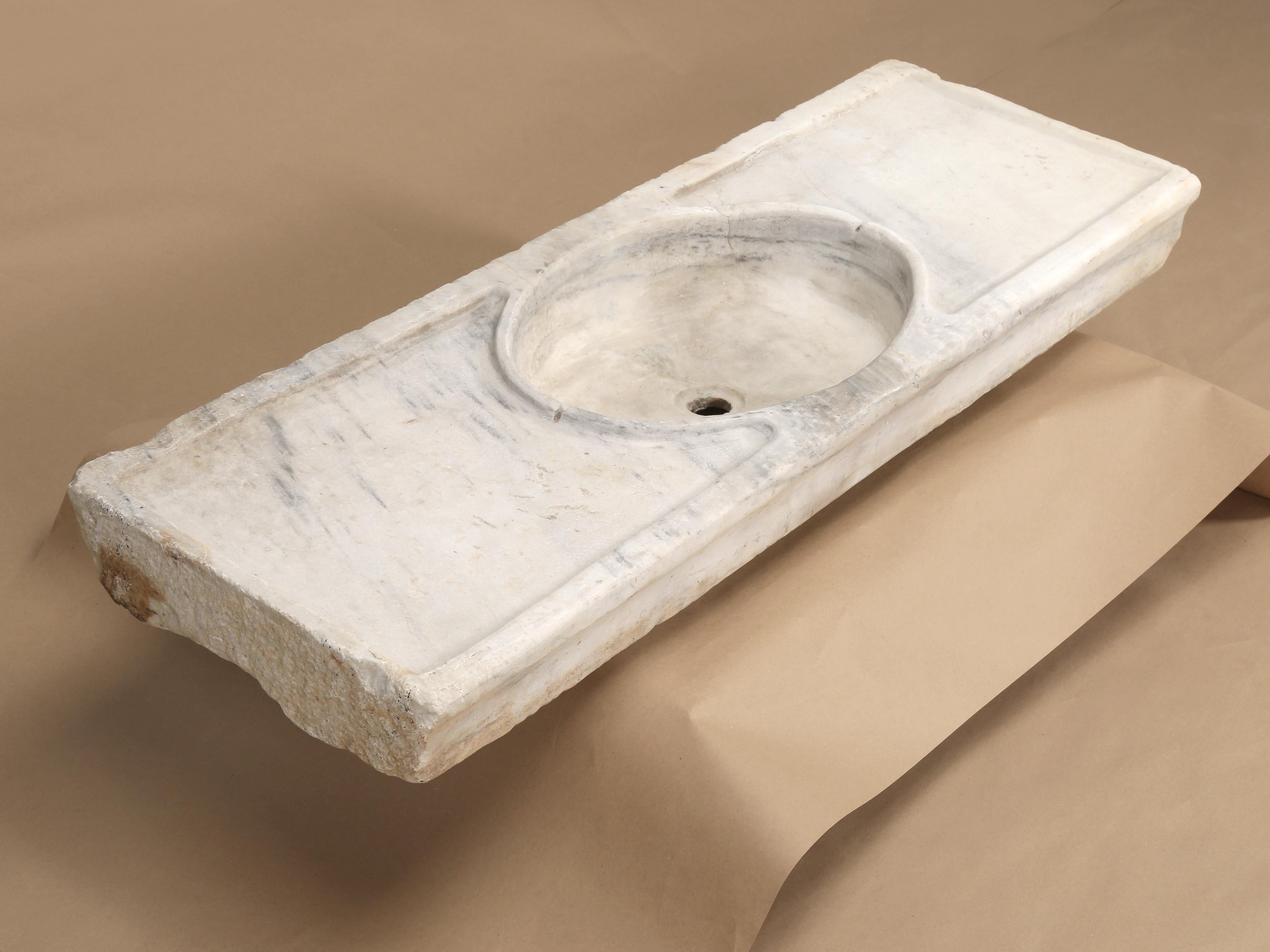 We believe that this sink was carved from a large block of statuary (also Statuario) marble, which comes from the mountains above Carrara, a town in Northern Tuscany. Statuary marble has a white background, but not a lot of color variation. Judging